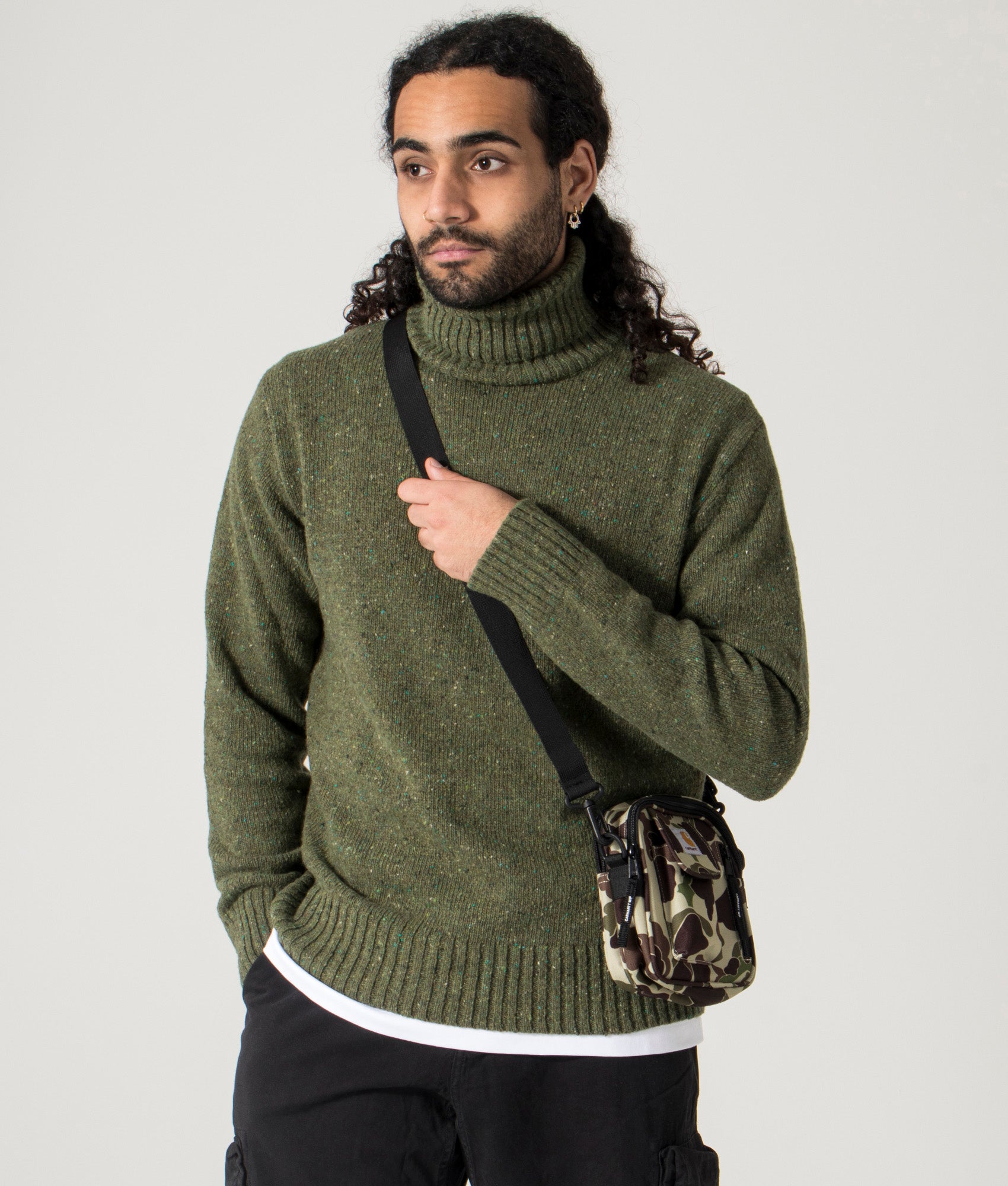 Universal Works - Tweed Roll Neck Jumper green. Model, shot at EQVVS. 