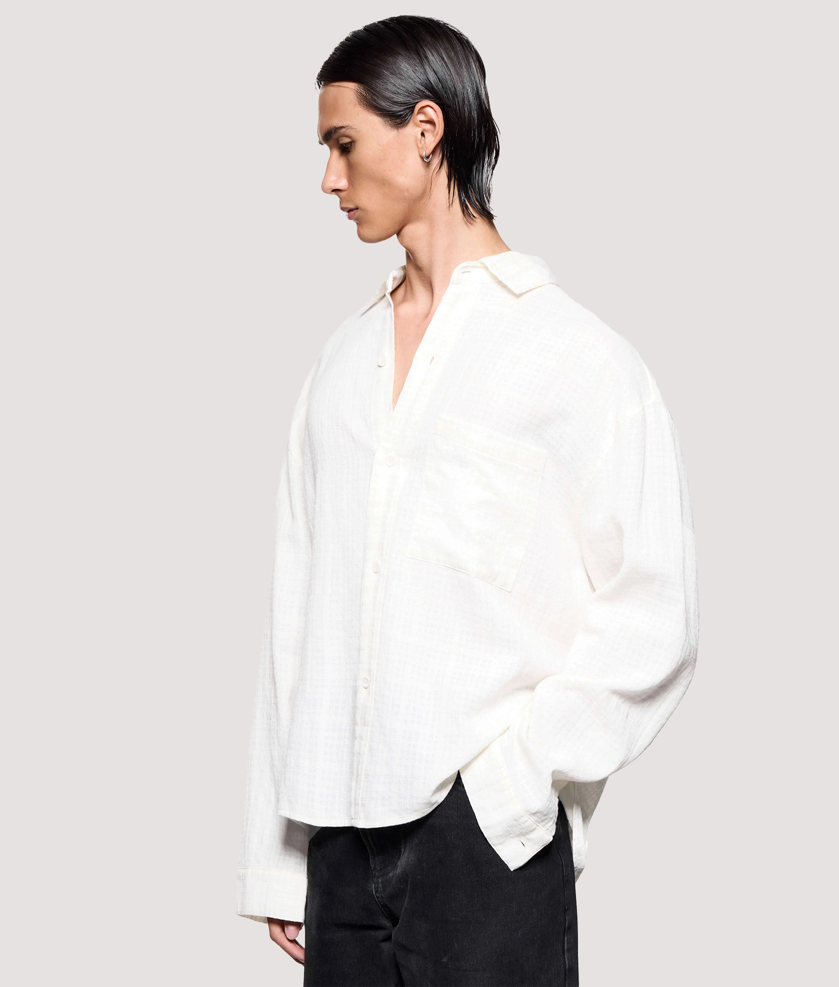 MKI MIYUKI ZOKU Box Fit Loose Weave Check Dress Shirt in Bone at EQVVS Menswear. Angled model front shot.