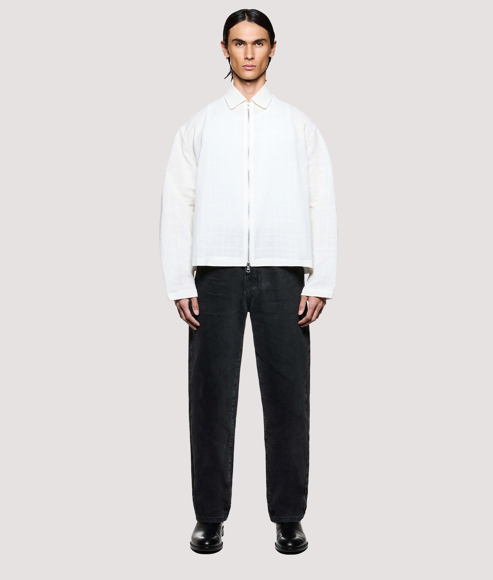 MKI MIYUKI ZOKU Box Fit Loose Weave Check Rider in Bone at EQVVS Menswear. Model full front shot.