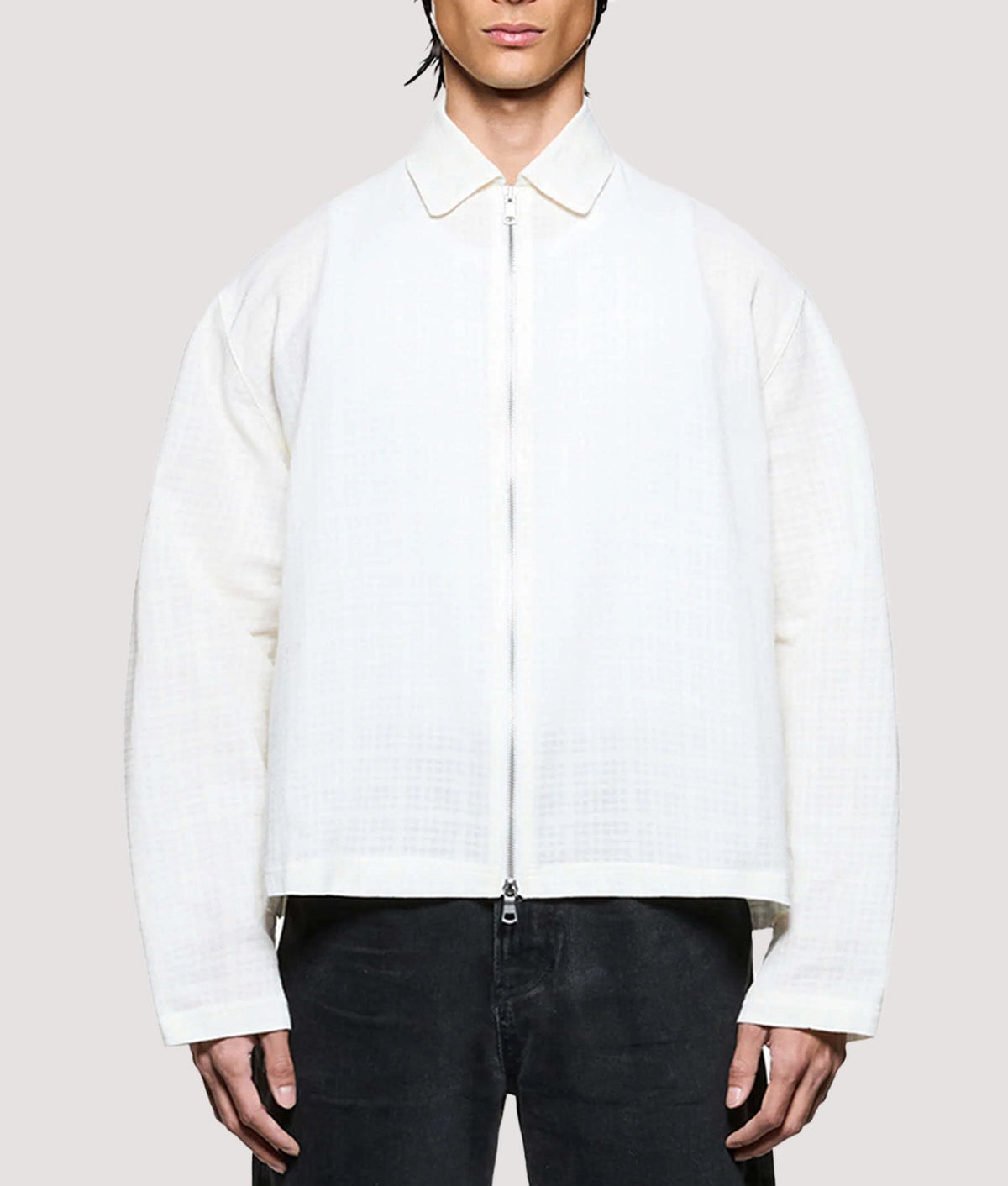 MKI MIYUKI ZOKU Box Fit Loose Weave Check Rider in Bone at EQVVS Menswear. Model front shot.