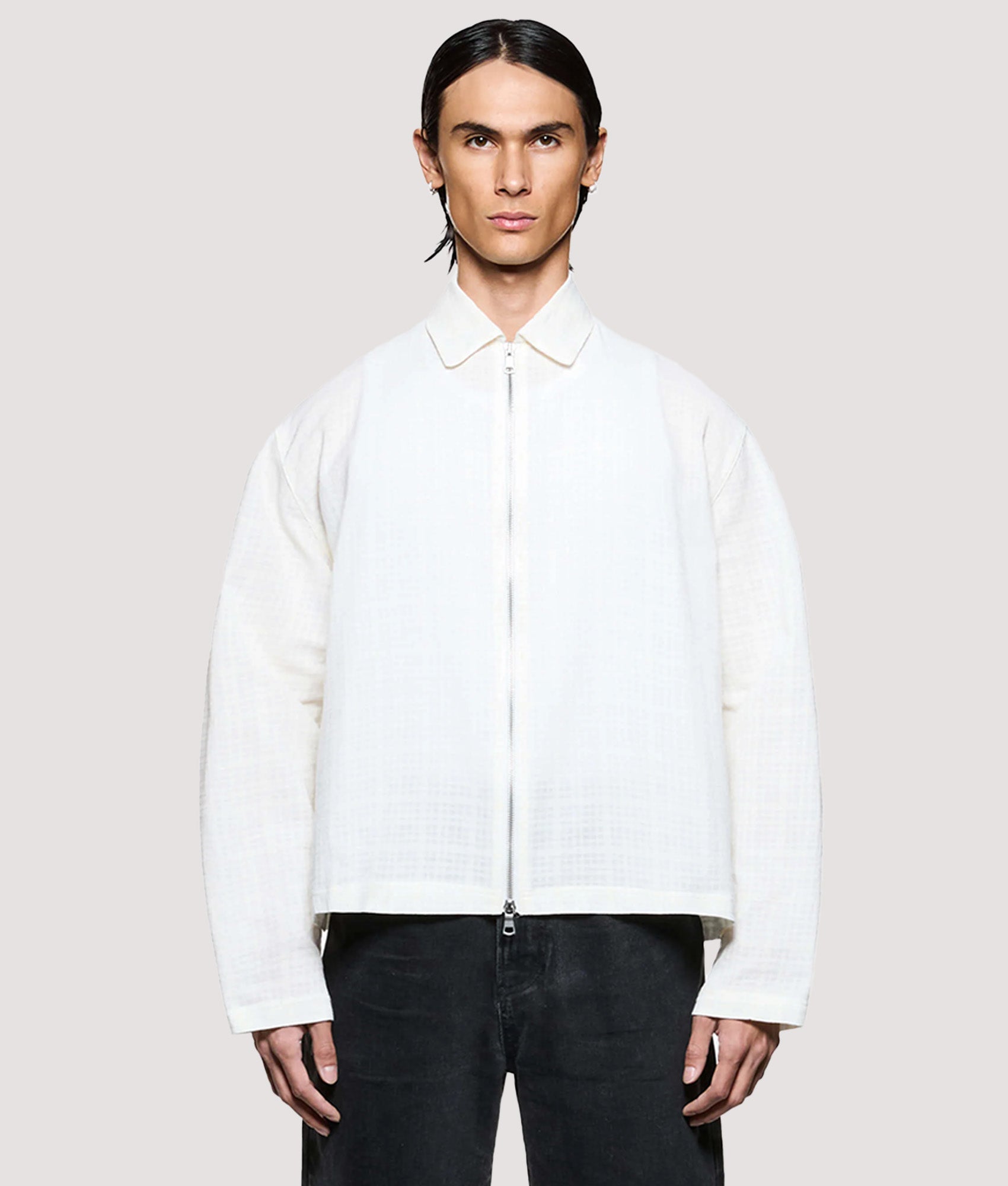 MKI MIYUKI ZOKU Box Fit Loose Weave Check Rider in Bone at EQVVS Menswear. Model front shot.