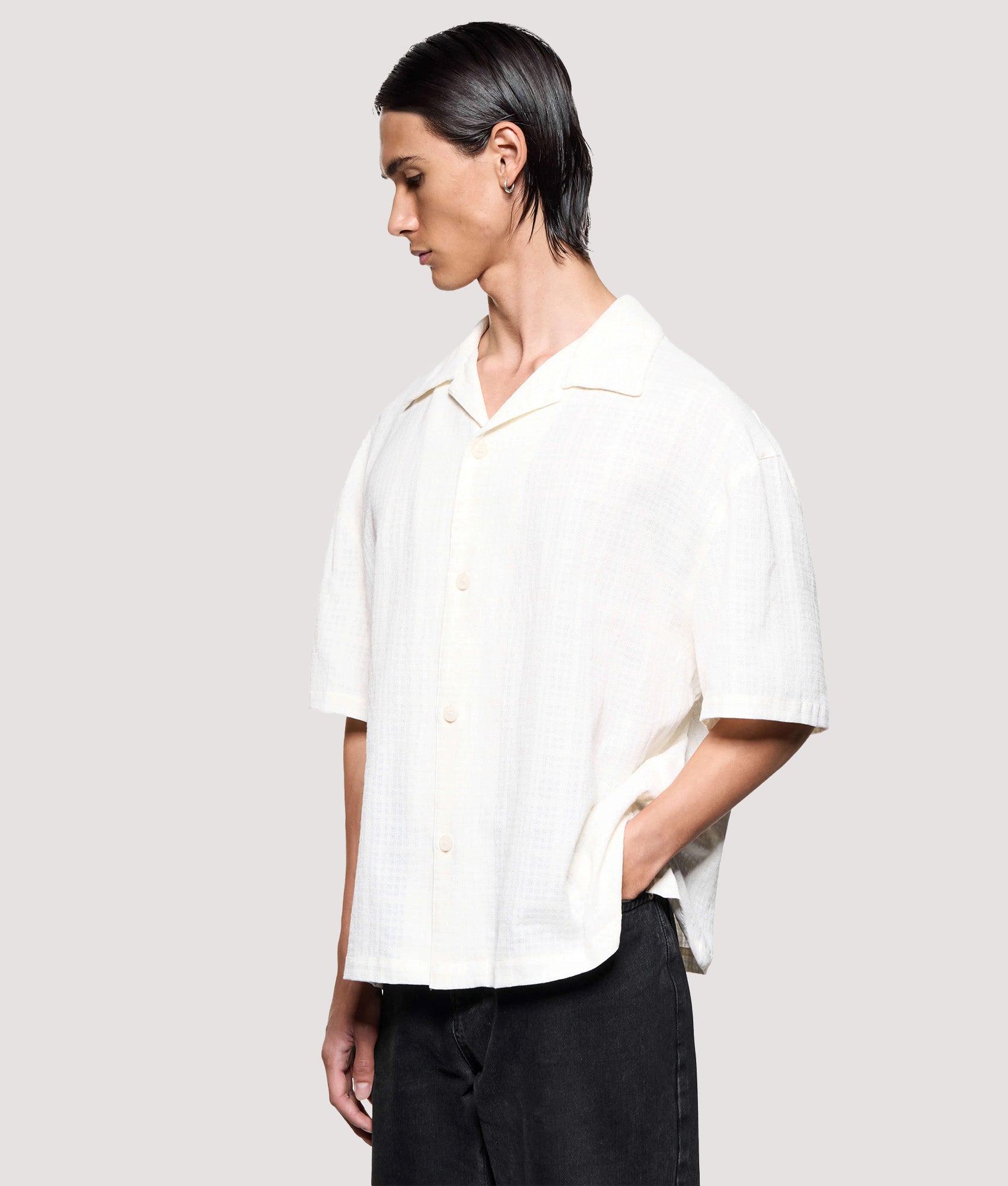 MKI MIYUKI ZOKU Box Fit Loose Weave Check Short Sleeve Vacation Shirt in Bone at EQVVS Menswear. Angled model front shot.