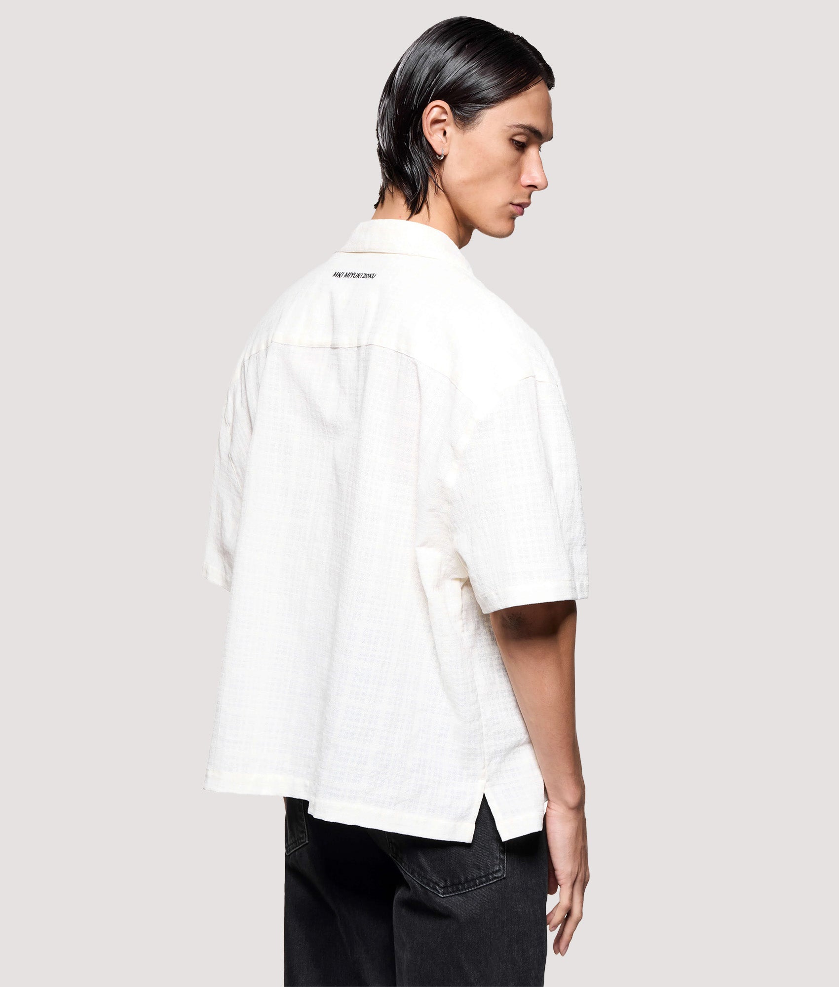 MKI MIYUKI ZOKU Box Fit Loose Weave Check Short Sleeve Vacation Shirt in Bone at EQVVS Menswear. Angled model front shot.