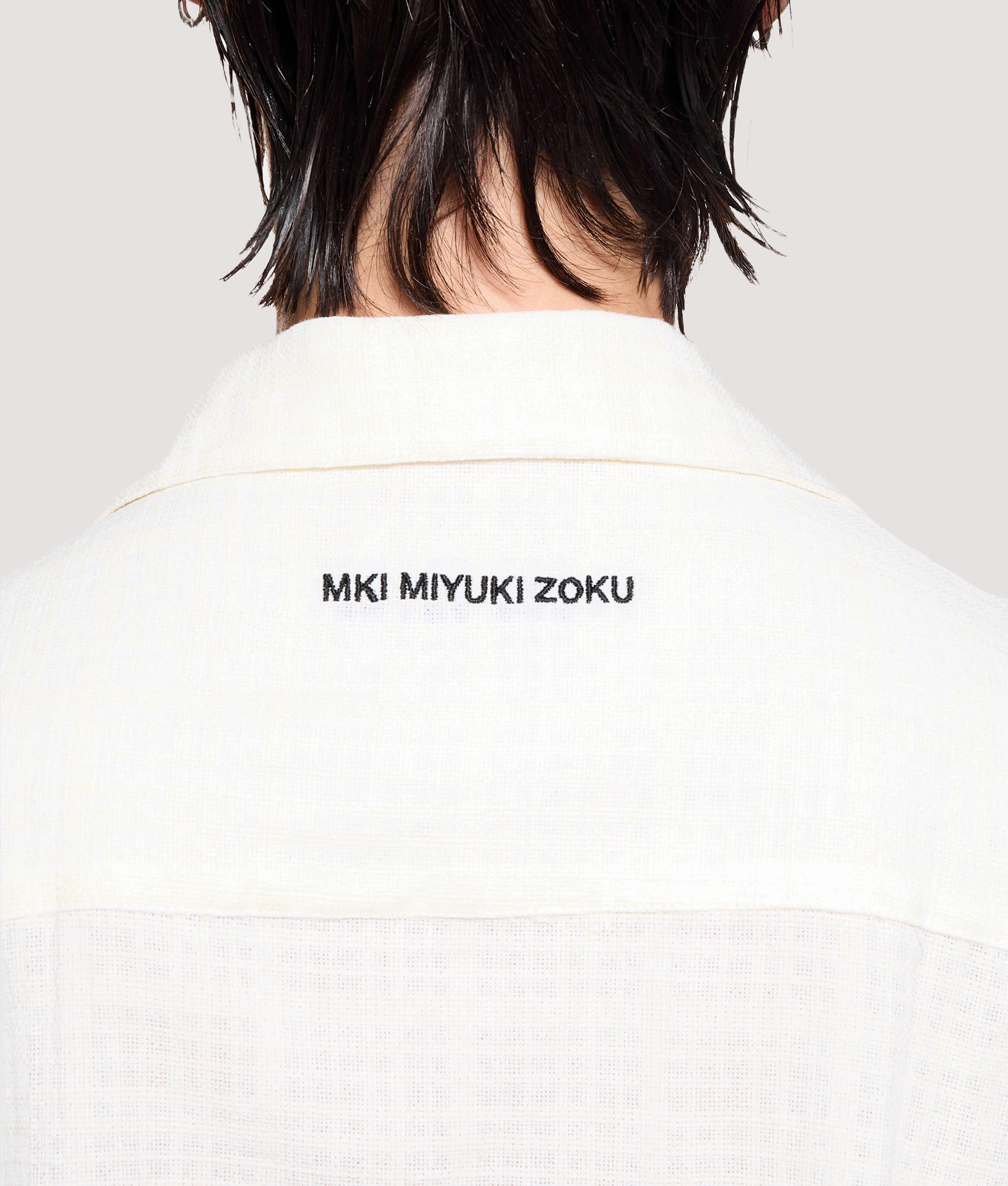 MKI MIYUKI ZOKU Box Fit Loose Weave Check Short Sleeve Vacation Shirt in Bone at EQVVS Menswear. Back detail shot.