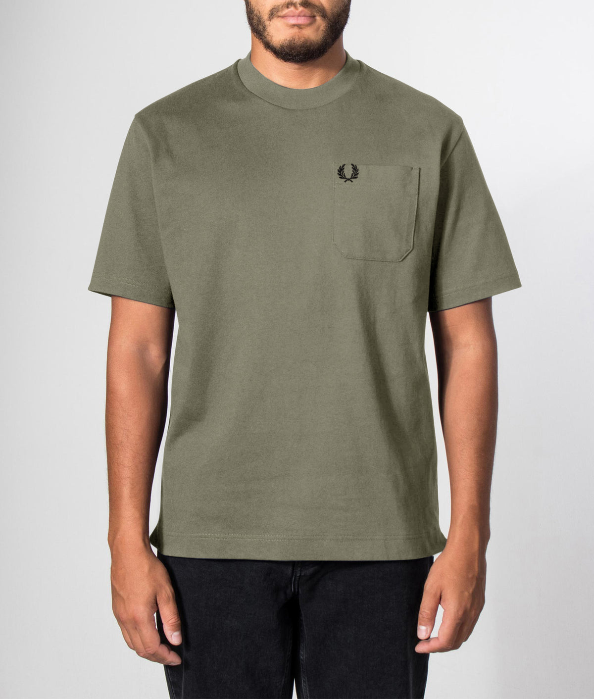 Fred Perry Relaxed Fit T-Shirt in Laurel Wreath Green at EQVVS Menswear. Front model shot.
