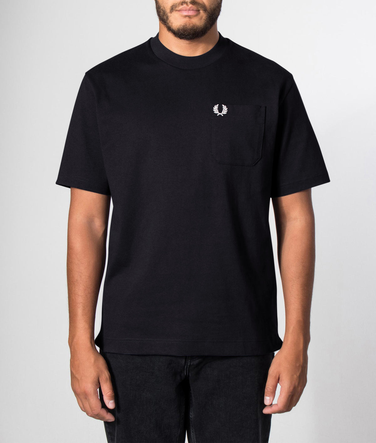 Fred Perry Relaxed Fit T-Shirt in Black at EQVVS Menswear. Front model shot.