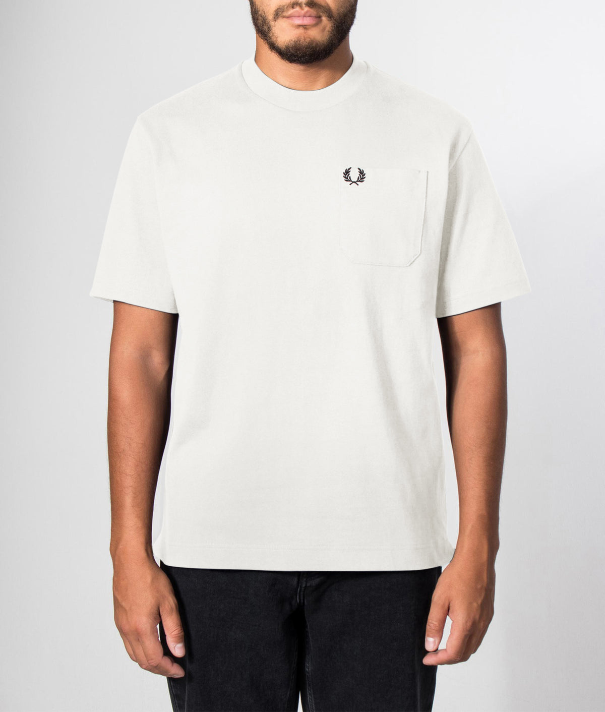 Fred Perry Relaxed Fit T-Shirt in Snow White at EQVVS Menswear. Front model shot.