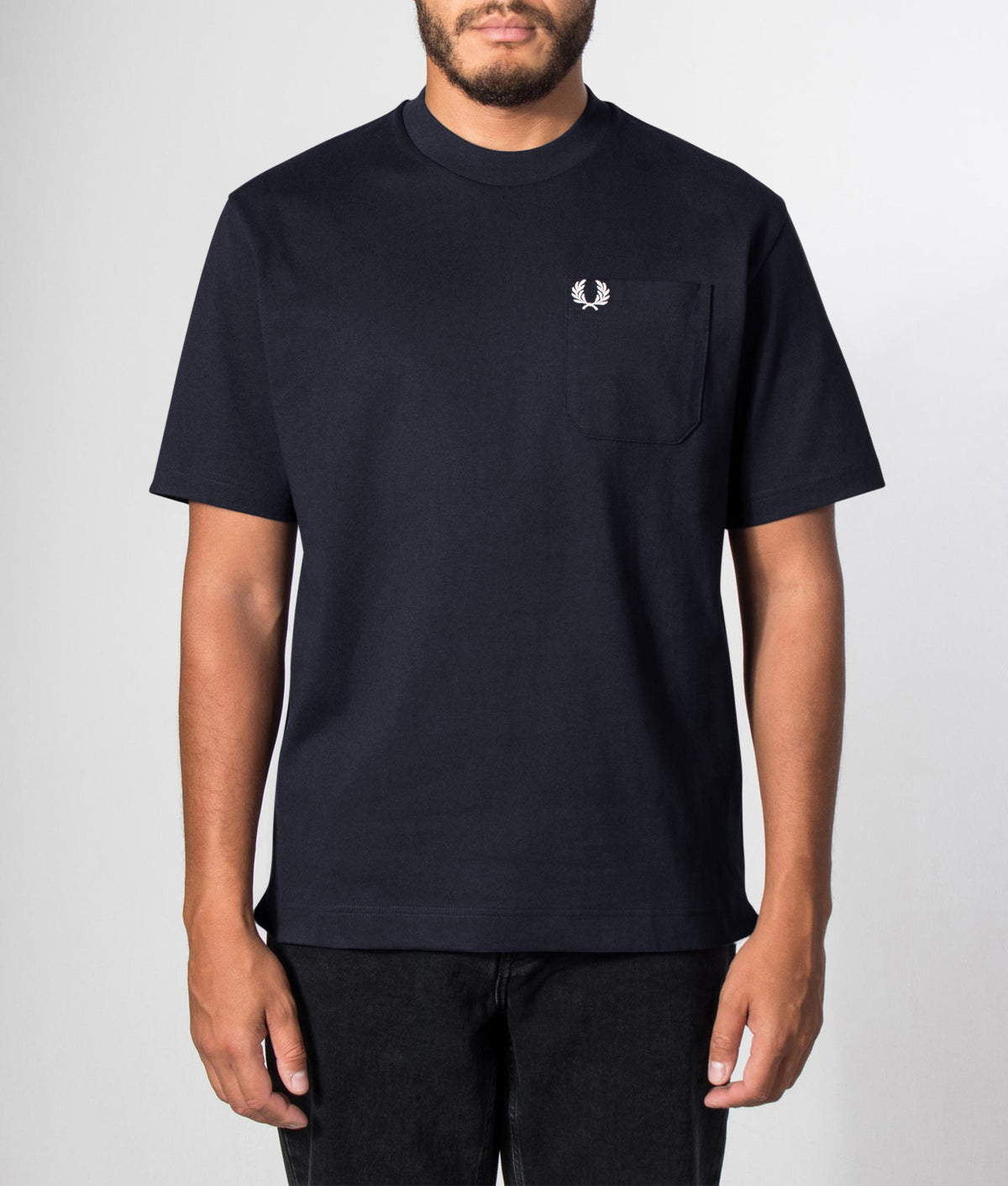 Fred Perry Relaxed Fit T-Shirt in Navy at EQVVS Menswear. Front model shot.