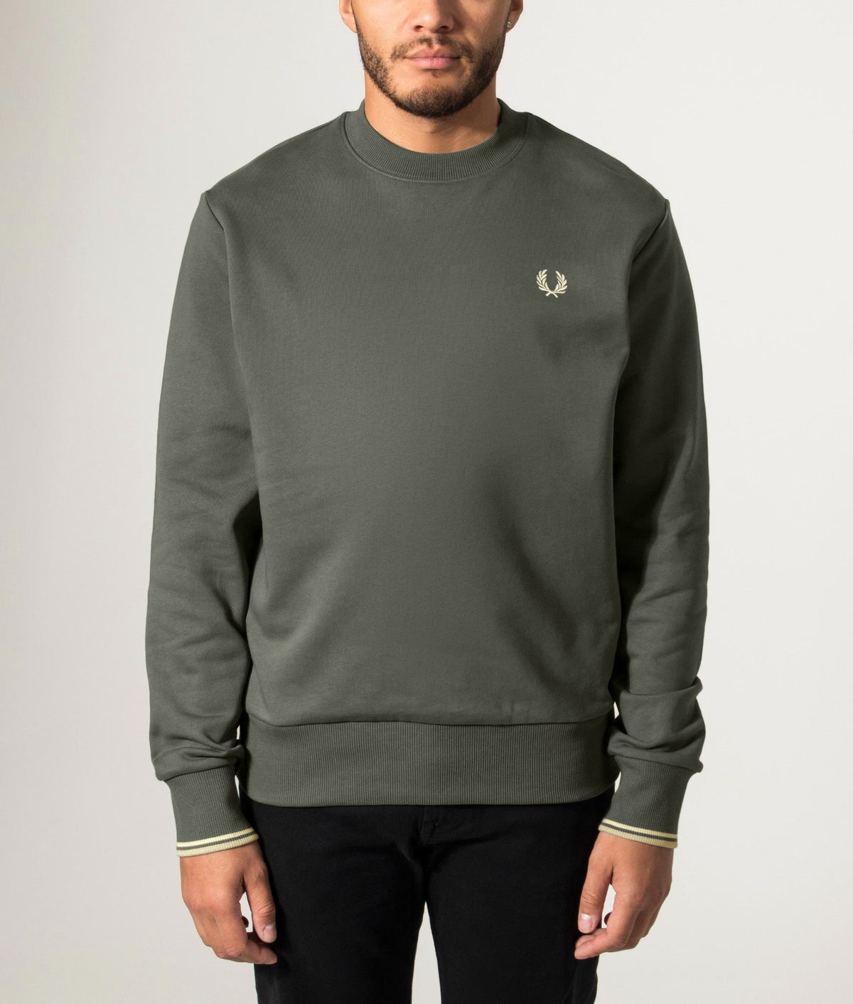 Fred Perry Regular Fit Crew Neck Sweatshirt in Field Green and Oatmeal at EQVVS Menswear. Front model shot.