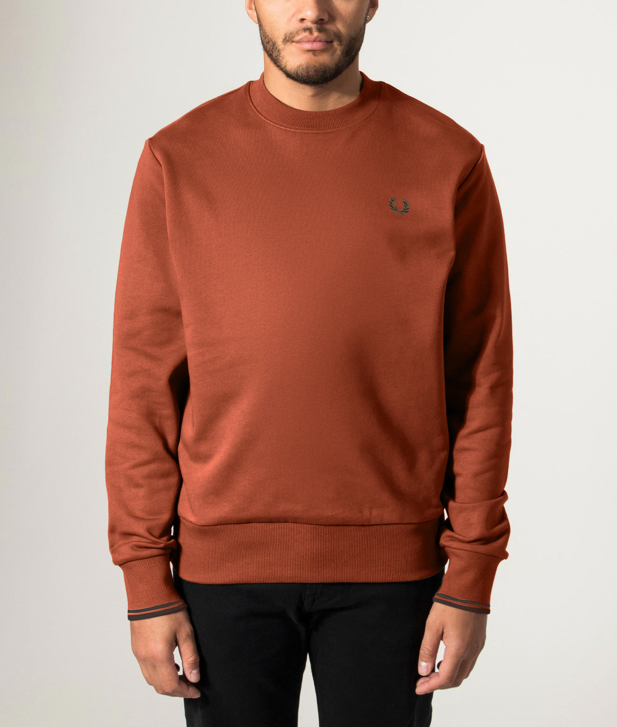 Fred Perry Regular Fit Crew Neck Sweatshirt in Brandy and Night Green at EQVVS Menswear. Front model shot.