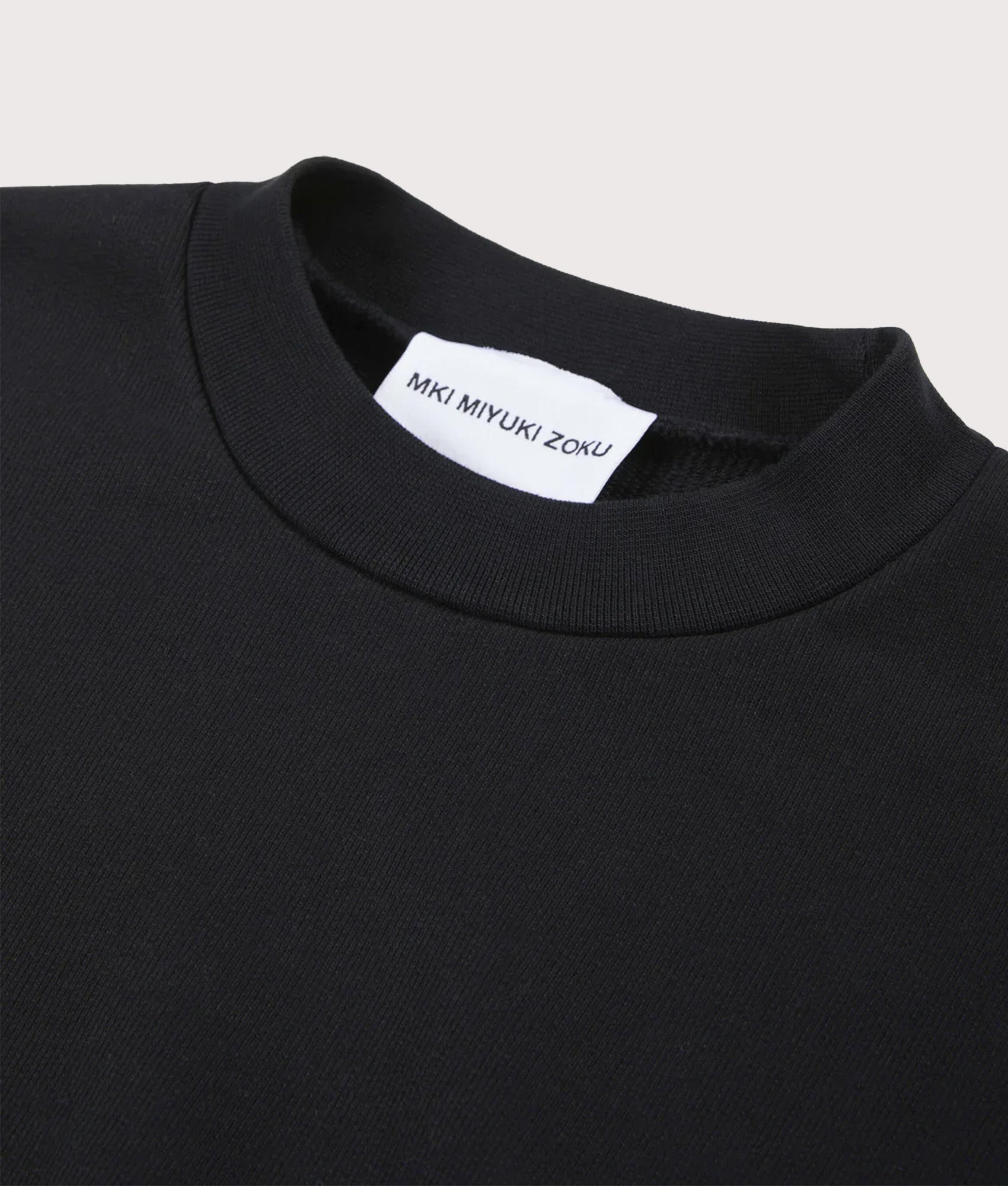 MKI Miyuki Zoku 800 GSM Superweight Crewneck Sweatshirt in Black at EQVVS. Detail shot.