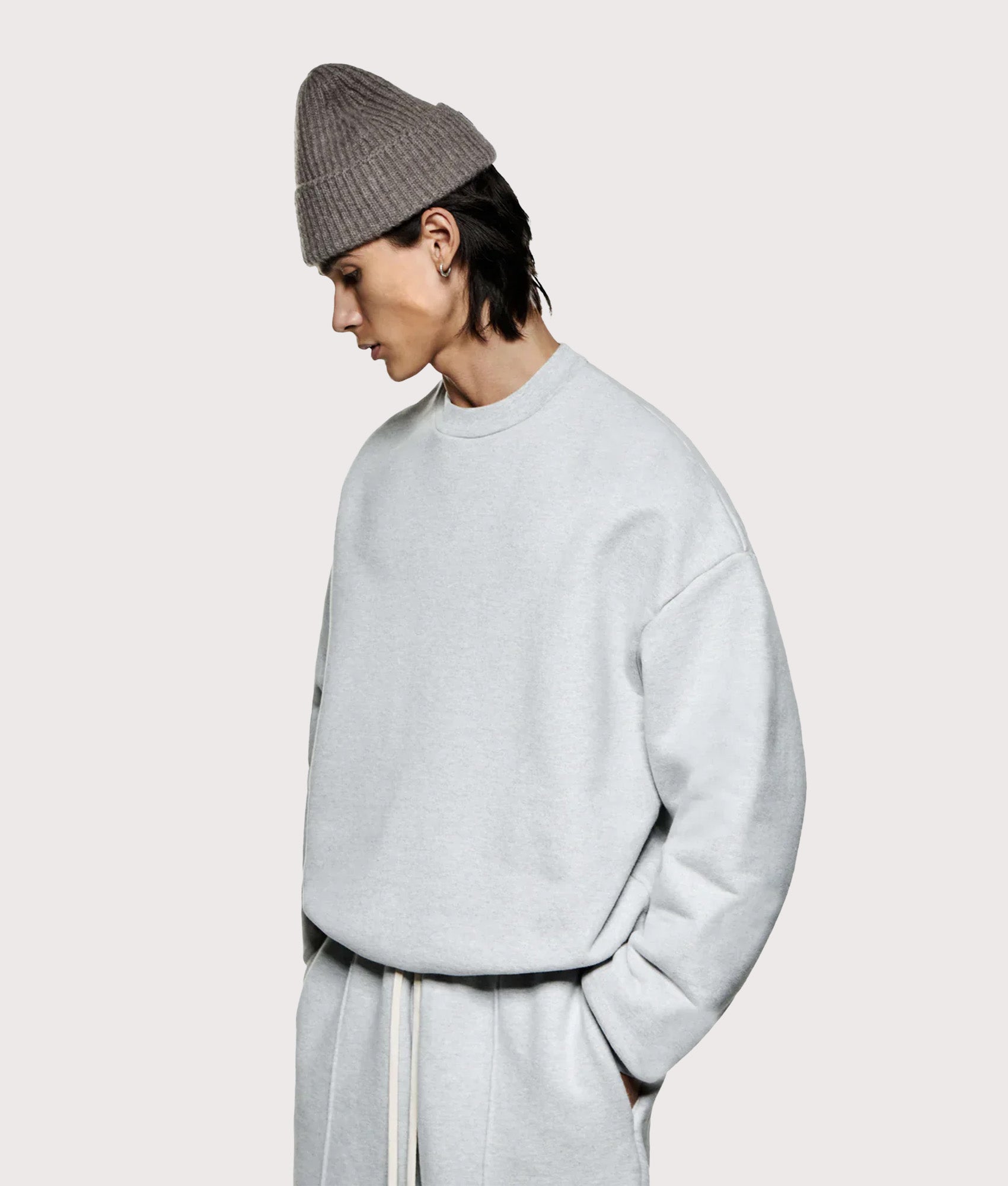 Oversized 800 GSM Superweight Sweatshirt in Grey by MKI MIYUKI ZOKU at EQVVS. Model angled front shot.