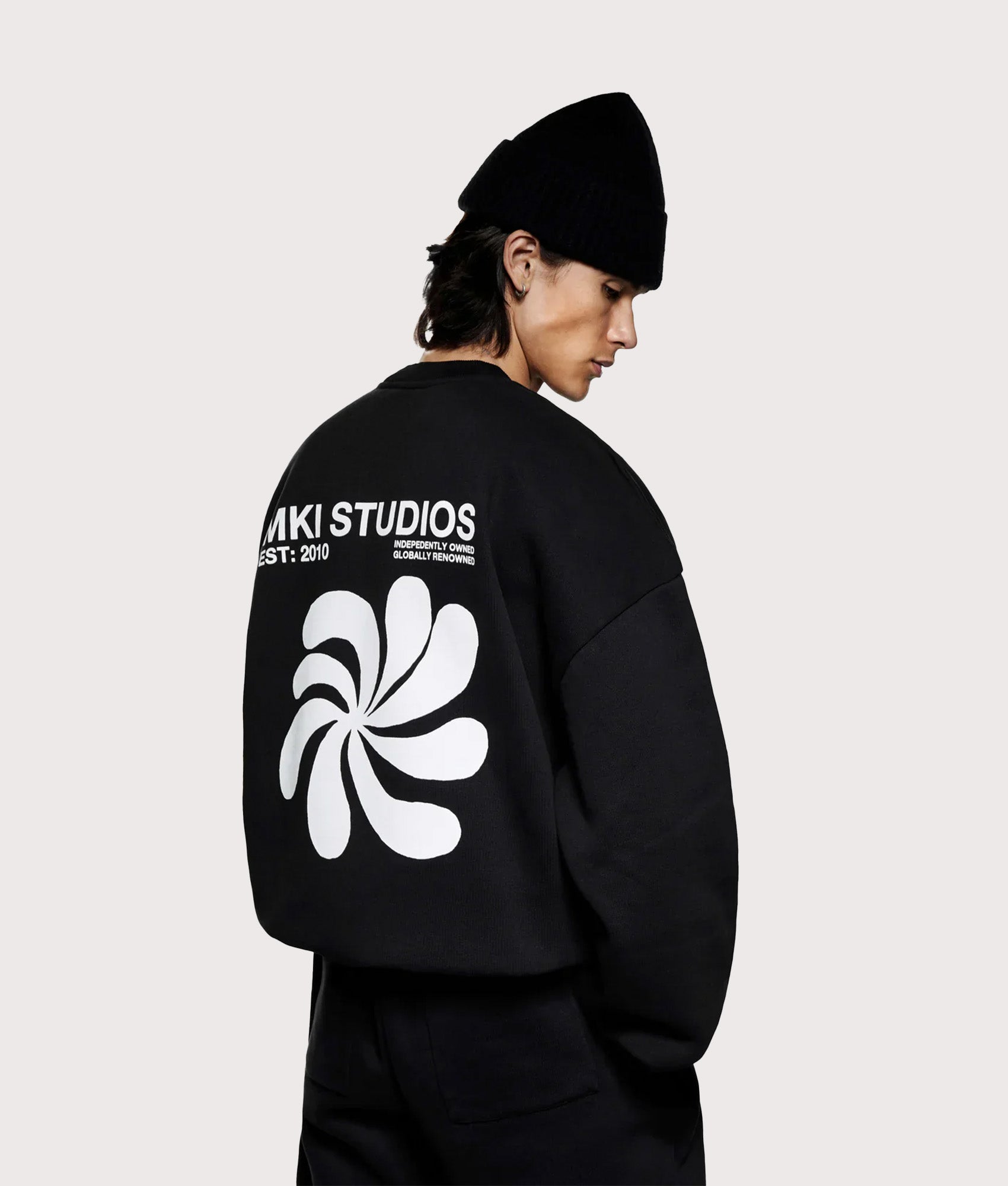 MKI MIYUKI ZOKU Oversized Abstract Crewneck Sweatshirt in Black at EQVVS Menswear. Model back shot.