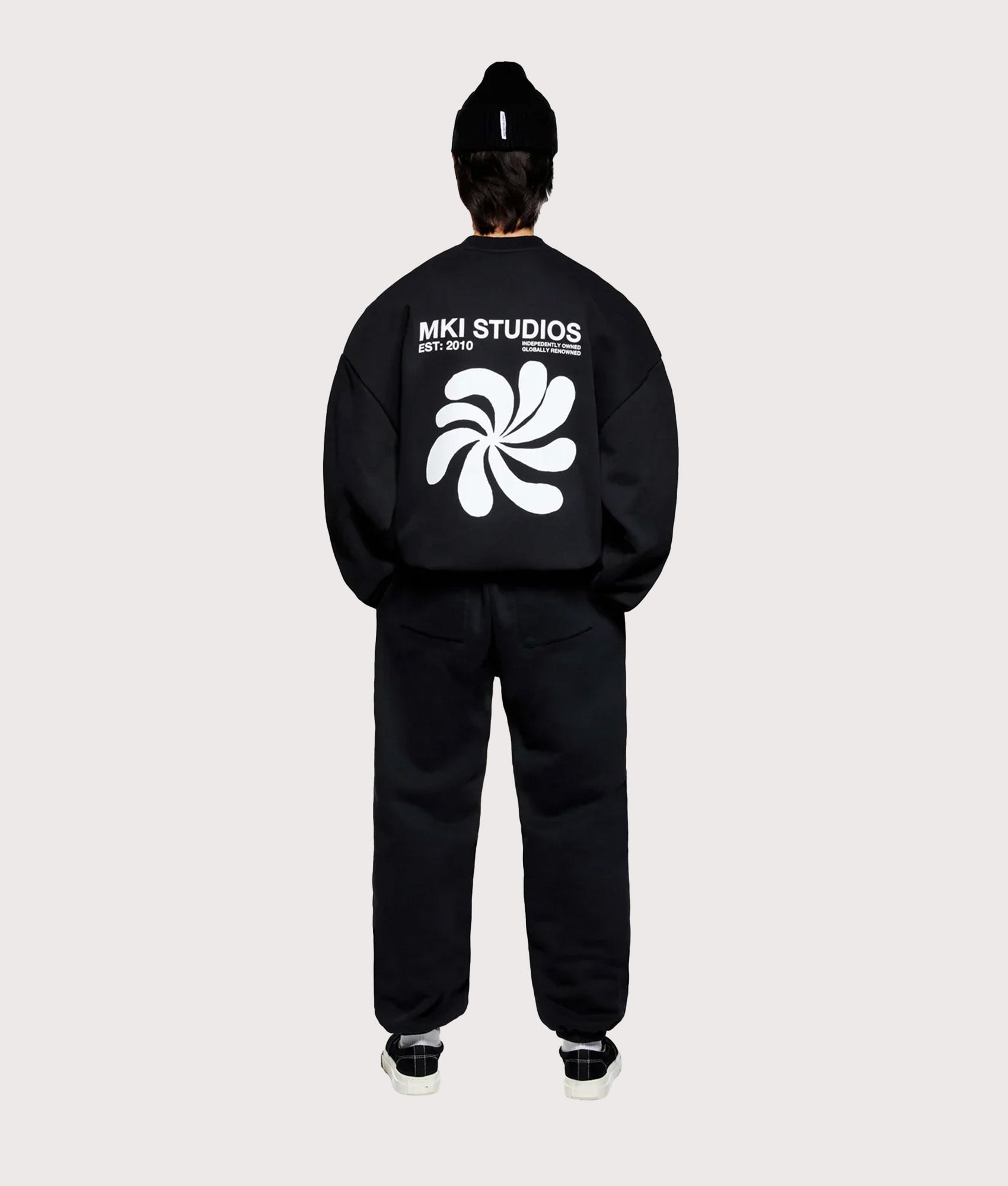 MKI MIYUKI ZOKU Oversized Abstract Crewneck Sweatshirt in Black at EQVVS Menswear.  Model full back shot.