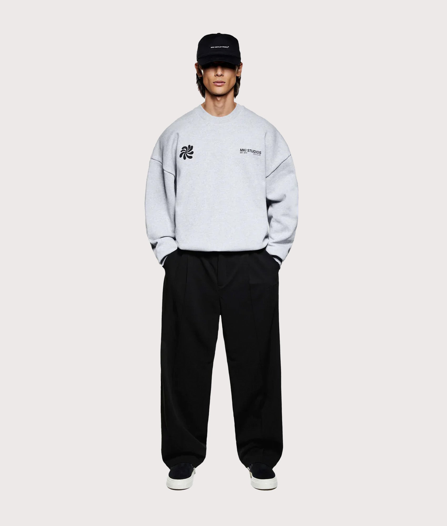 MKI MIYUKI ZOKU Oversized Abstract Crewneck Sweatshirt in Grey at EQVVS Menswear. Model full front shot.