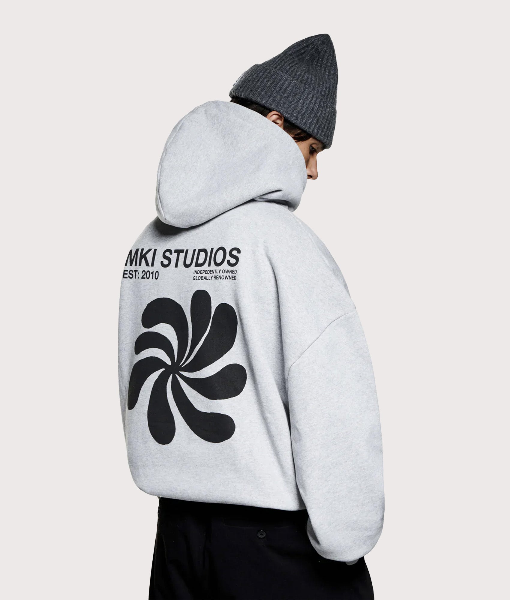 MKI MIYUKI ZOKU Oversized Abstract Hoodie in Grey at EQVVS Menswear. Model back shot.
