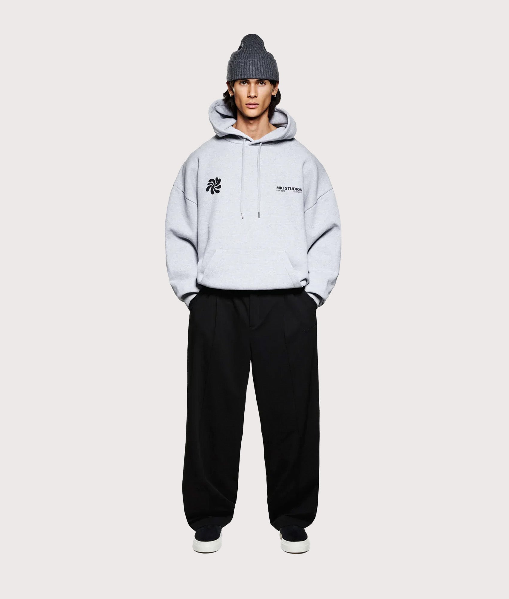 MKI MIYUKI ZOKU Oversized Abstract Hoodie in Grey at EQVVS Menswear. Model full front shot.