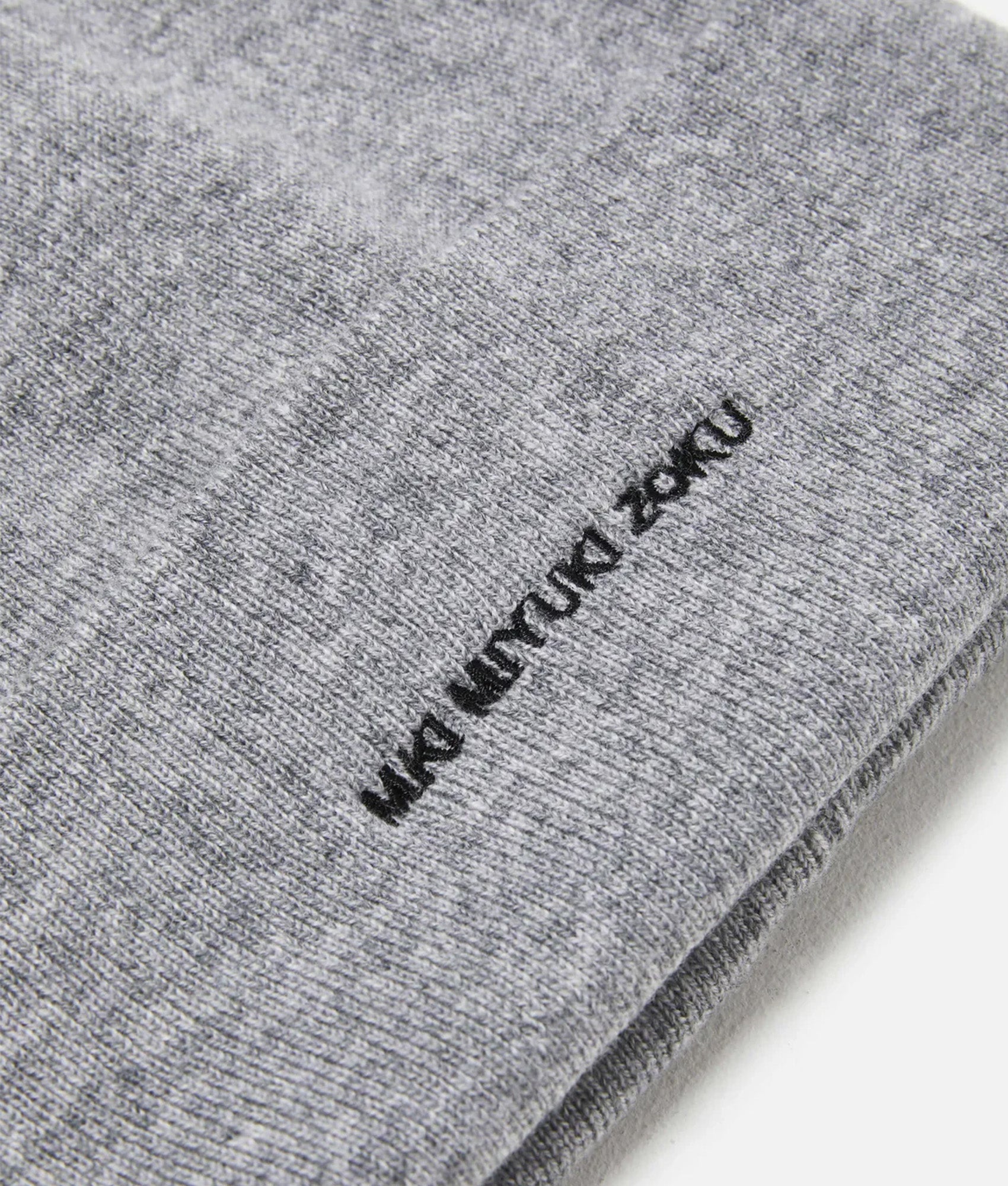 MKI MIYUKI ZOKU Embroidered Merino Beanie in Grey at EQVVS Menswear. Detail shot.