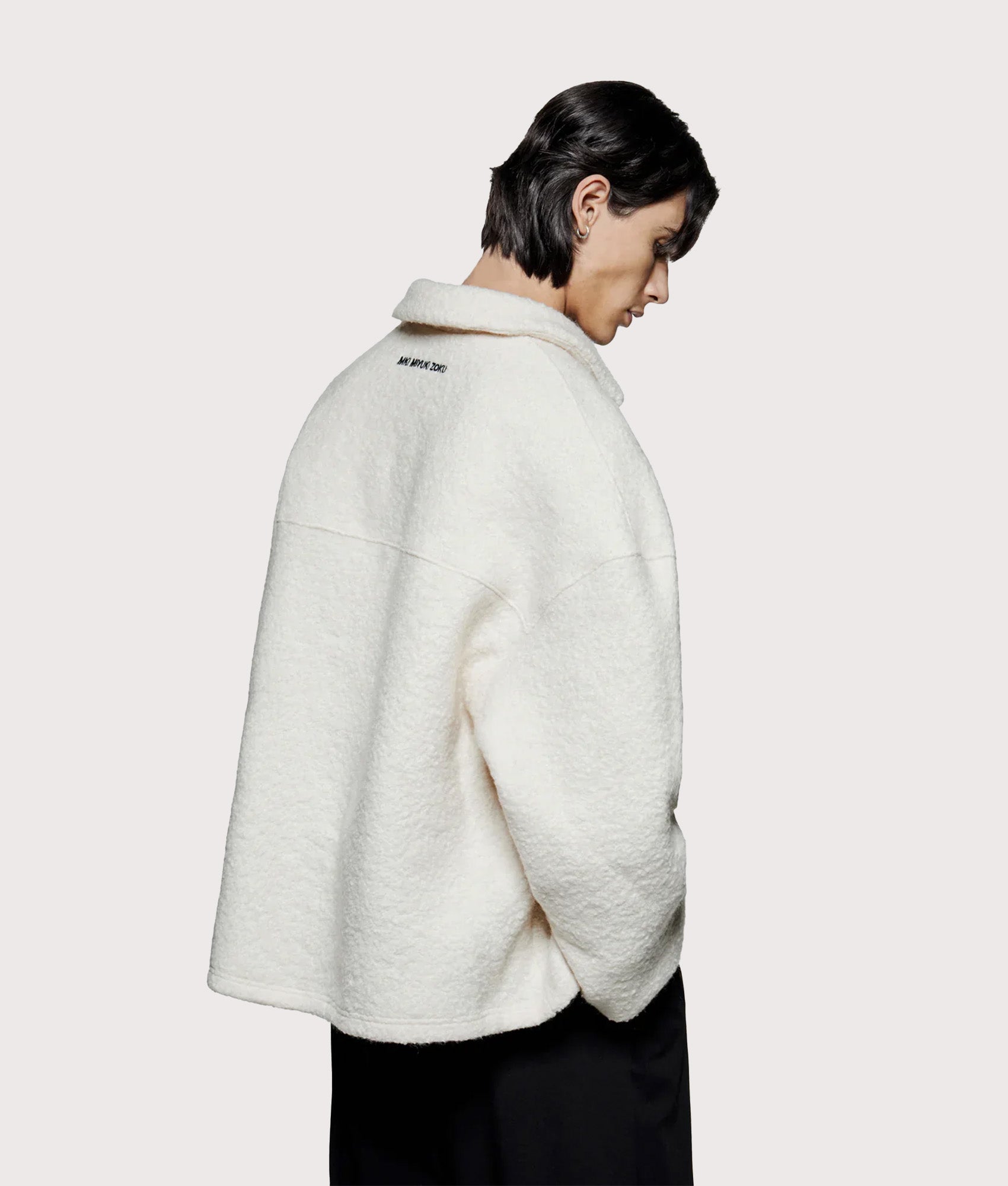 MKI MIYUKI ZOKU Oversized Fit Boucle Quarter Zip Overshirt in Off White at EQVVS Menswear. Model back shot.