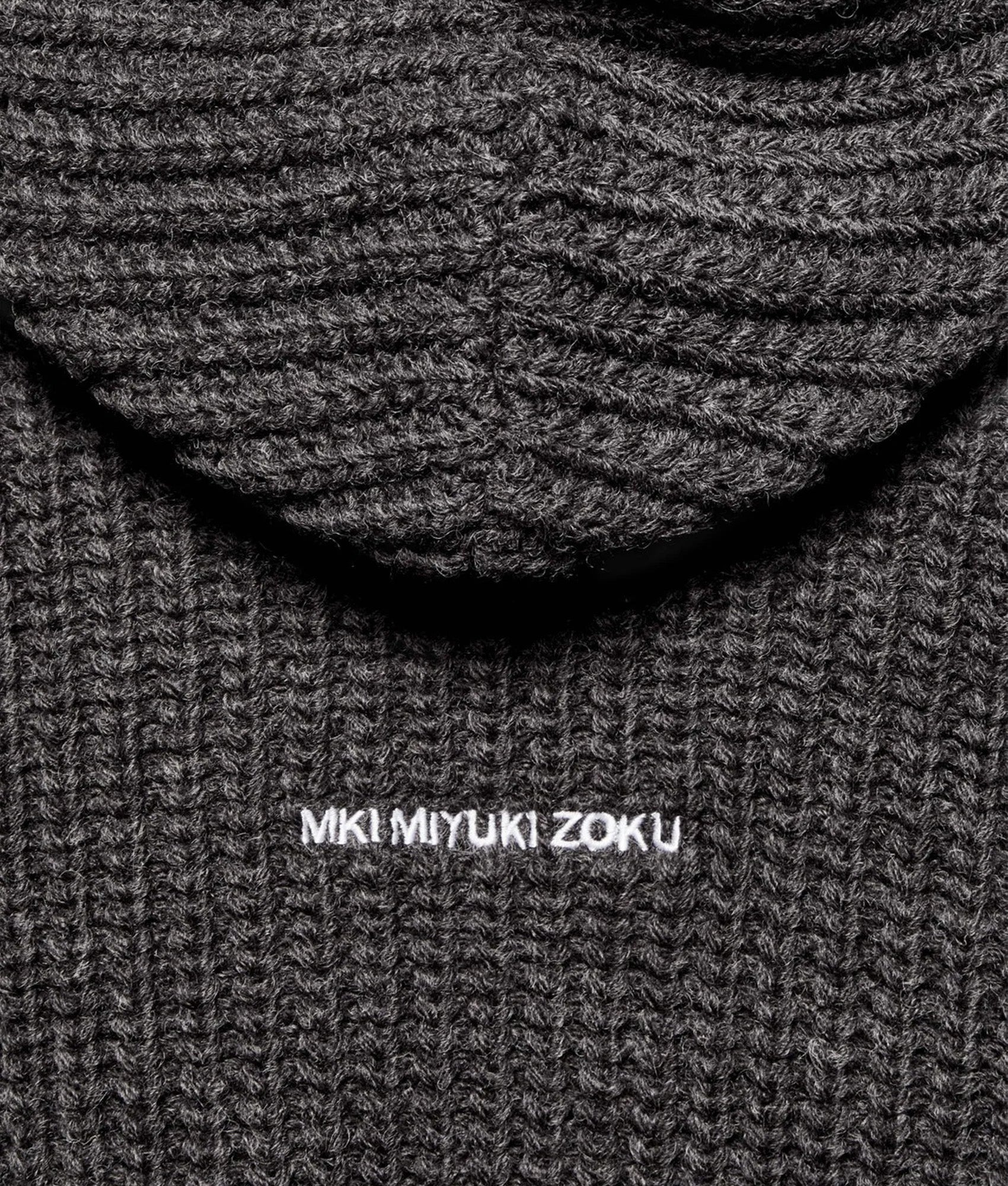 MKI MIYUKI ZOKU Oversized Chunky Rib Knit Hoodie in Charcoal Melange at EQVVS Menswear. Detail shot.