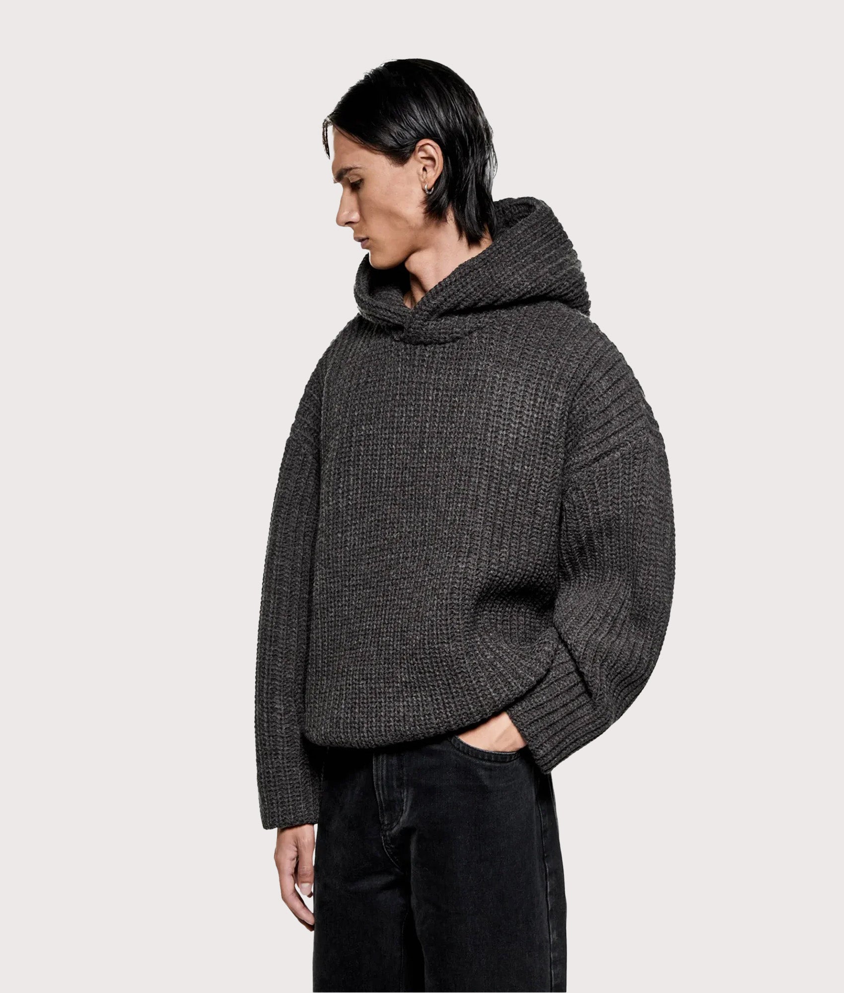 MKI MIYUKI ZOKU Oversized Chunky Rib Knit Hoodie in Charcoal Melange at EQVVS Menswear. Model front shot.