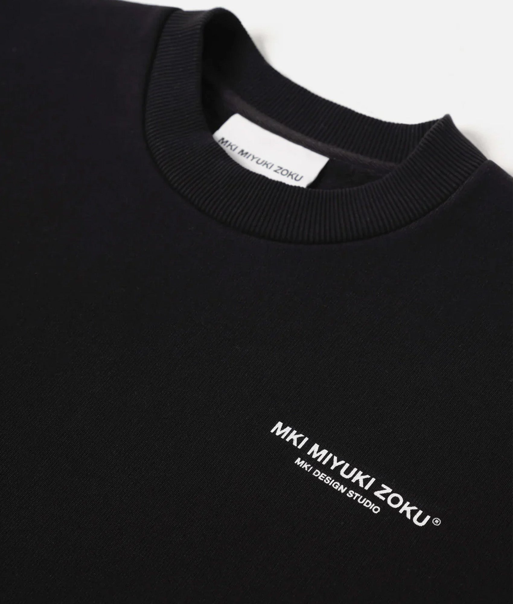 MKI MIYUKI ZOKU Oversized studio sweatshirt in Black at EQVVS Menswear. Detail shot.