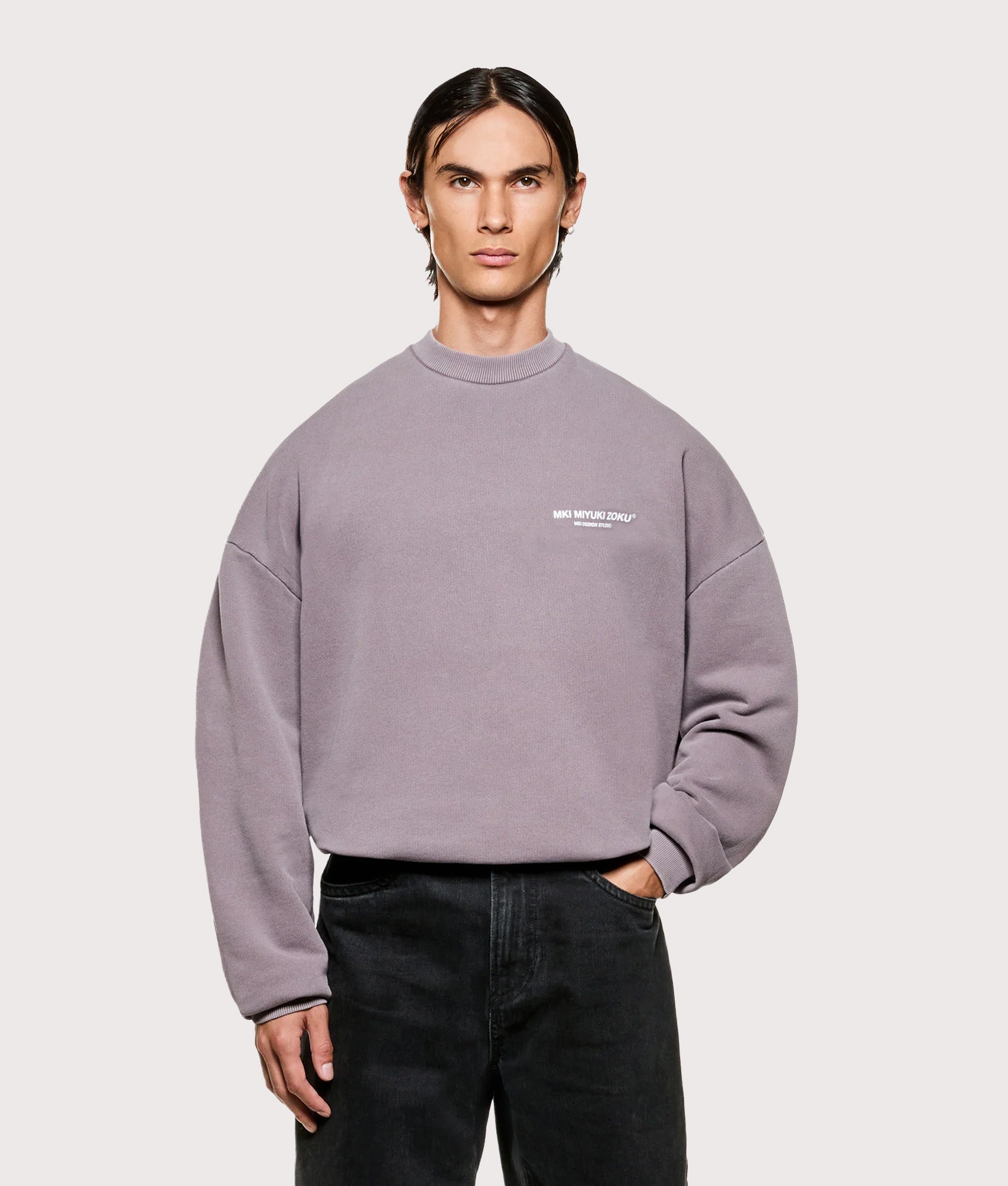 MKI MIYUKI ZOKU Oversized Design Studio Crewneck Sweatshirt in Pigment Raisin. Front shot.