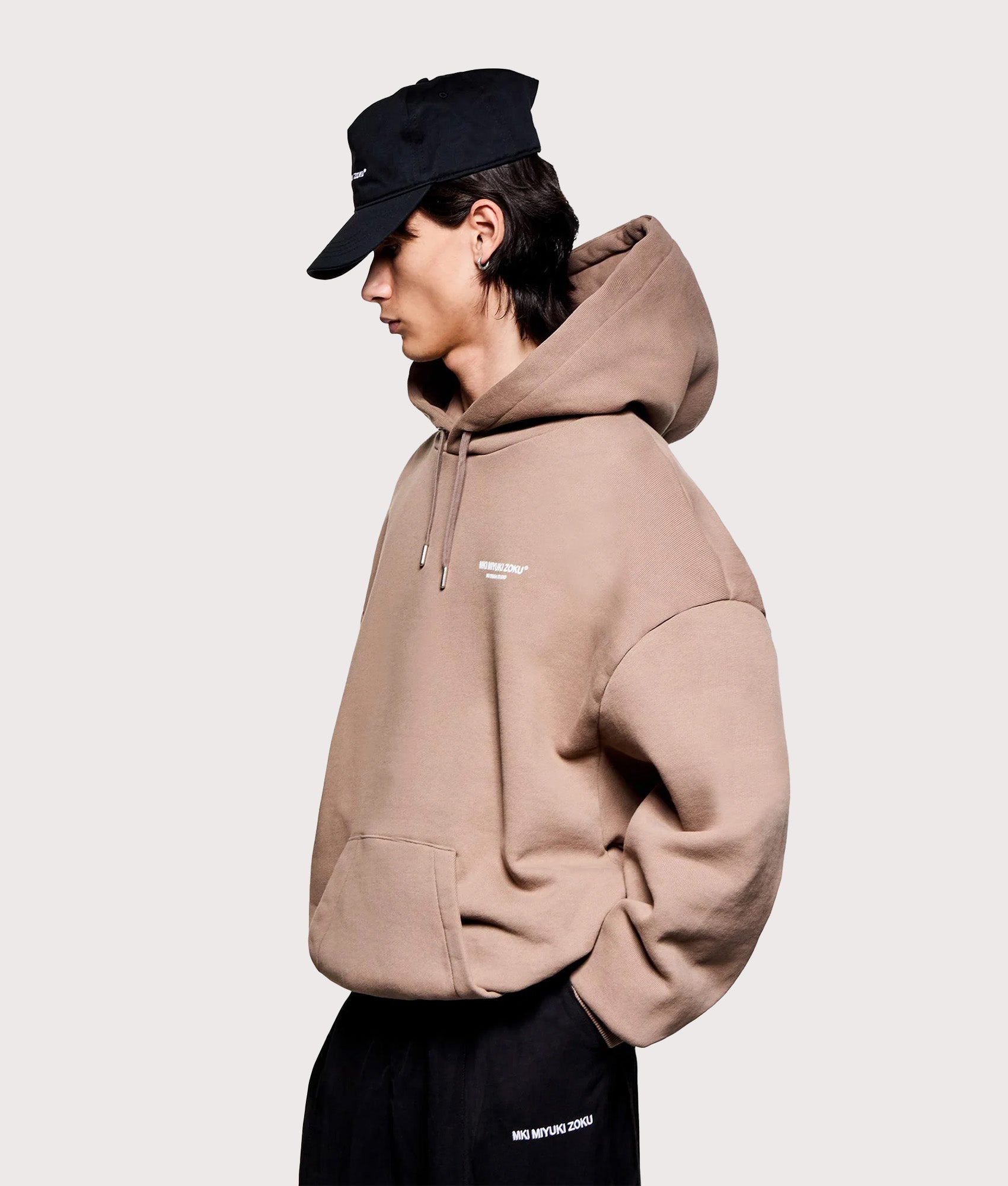 MKI MIYUKI ZOKU Oversized Design Studio Hoodie in Mushroom at EQVVS Menswear.  Angled model front shot.