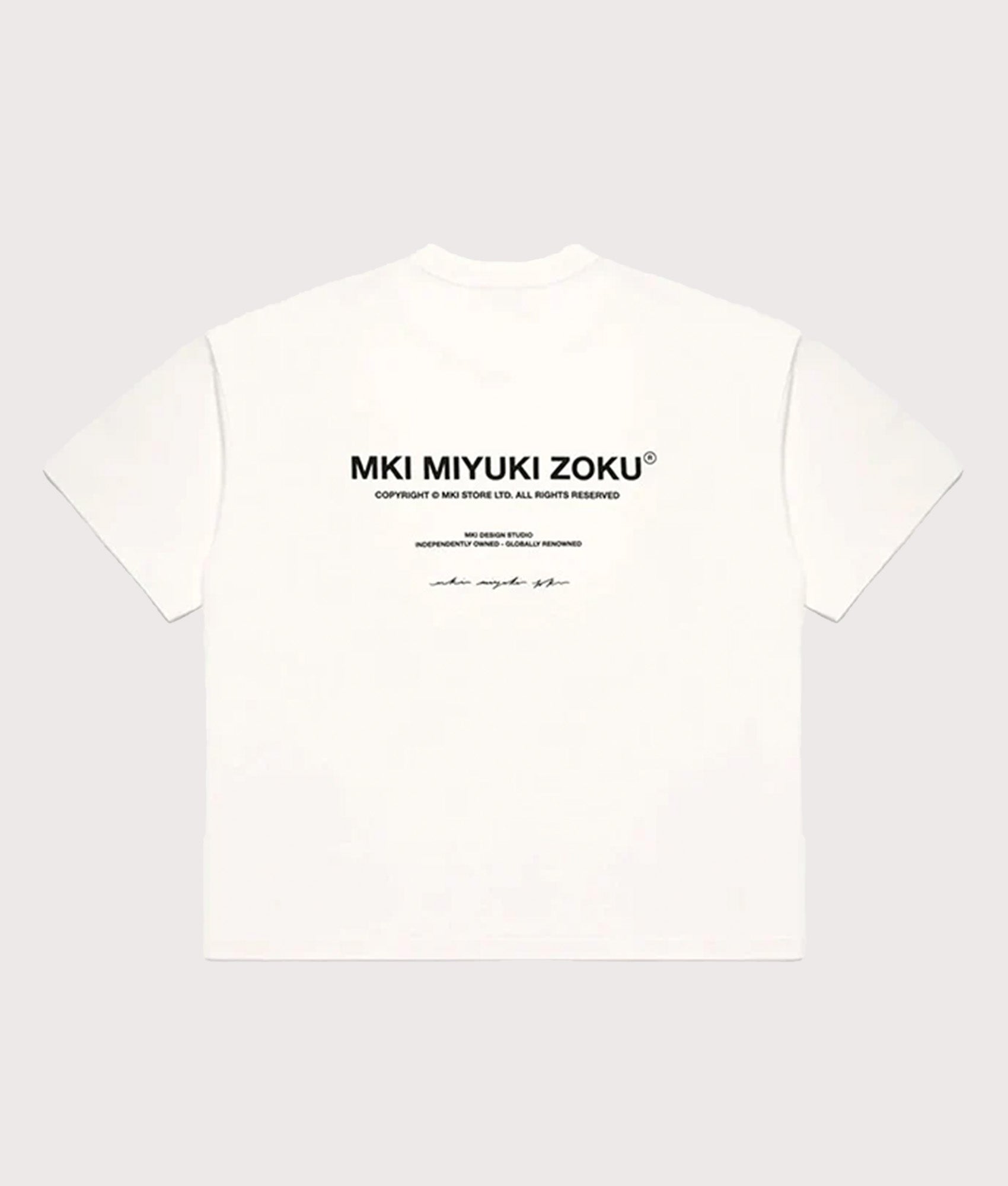 MKI MIYUKI ZOKU Oversized Fit Design Studio T-Shirt in White at EQVVS Menswear. Back shot.