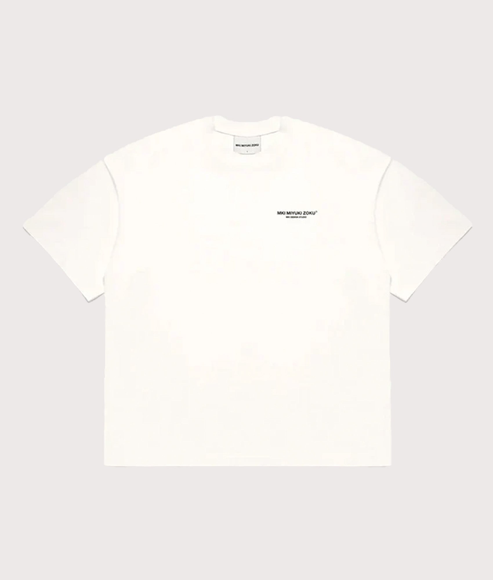 MKI MIYUKI ZOKU Oversized Fit Design Studio T-Shirt in White at EQVVS Menswear. Front shot.