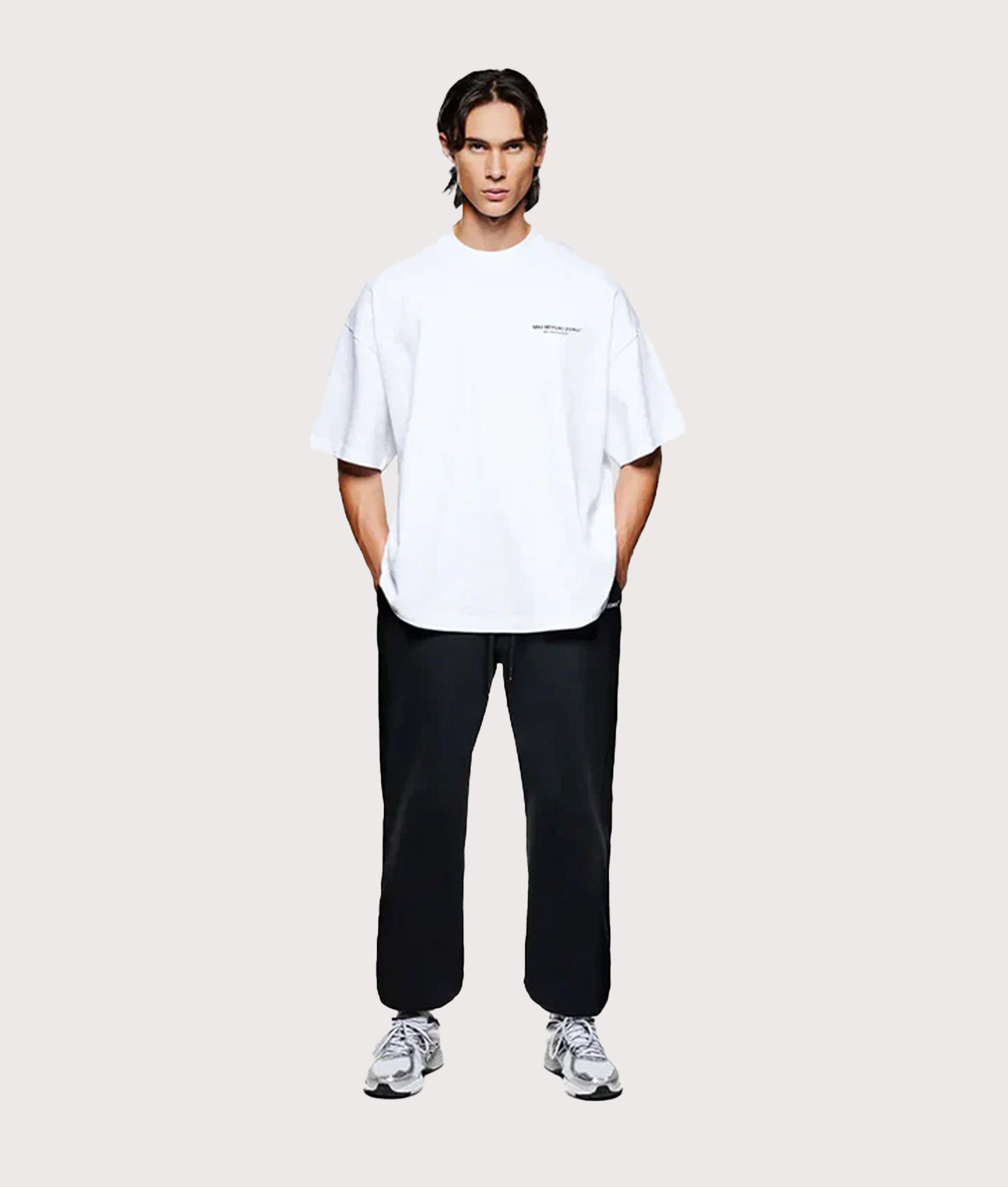 MKI MIYUKI ZOKU Oversized Fit Design Studio T-Shirt in White at EQVVS Menswear. model full front shot.