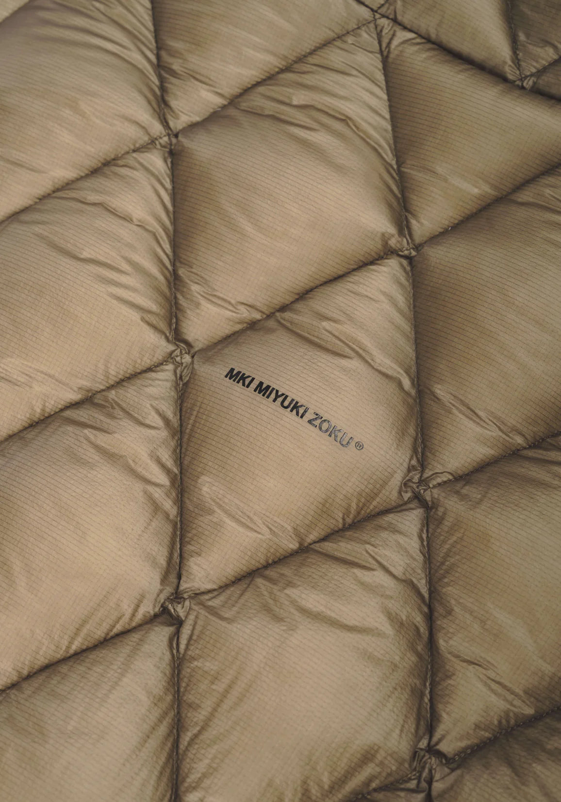 MKI Diamond Quilted Bubble Jacket. Khaki.  Detail shot. 