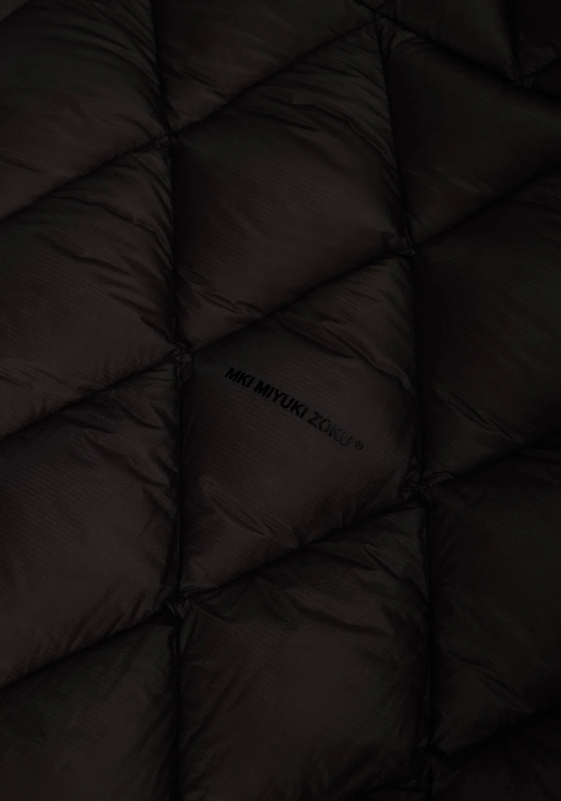 Diamond Bubble Jacket in black by MKI Miyuki Zoku. Detail shot. 