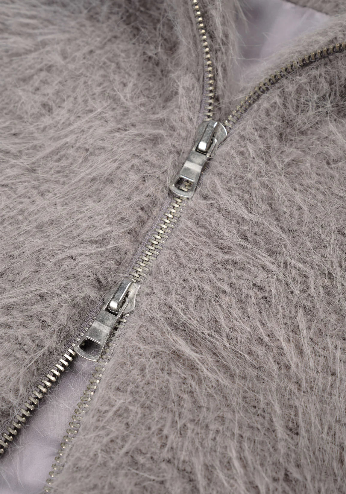 MKI Miyuki Zoku Faux Alpaca Track Jacket Light Grey. Detail shot. 
