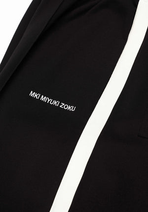Wide fit track pants MKI Miyuki Zoku black. Detail shot. 