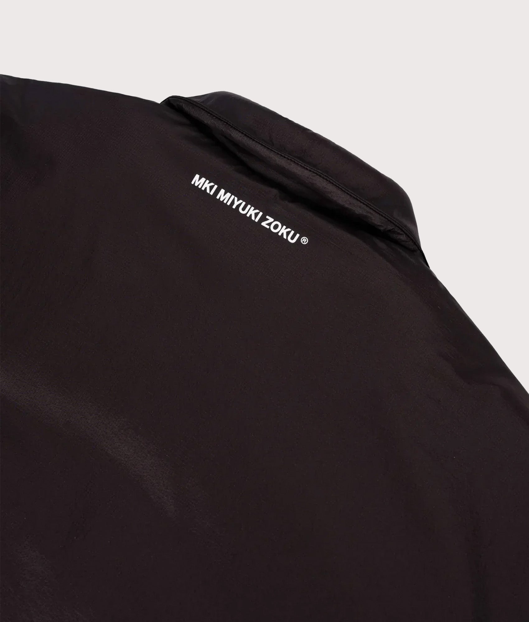 MKI MIYUKI ZOKU Relaxed Fit Insulated Loft Rider Jacket in Black at EQVVS Menswear. Detail shot.