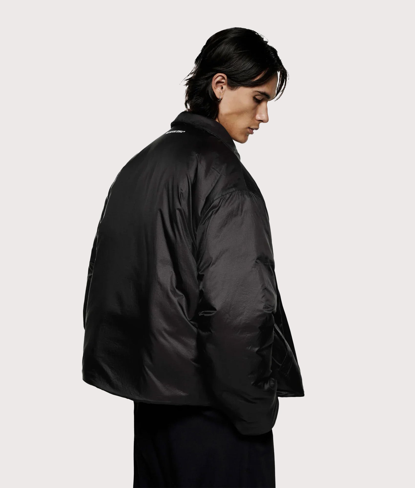 MKI MIYUKI ZOKU Relaxed Fit Insulated Loft Rider Jacket in Black at EQVVS Menswear. Model angled back shot.