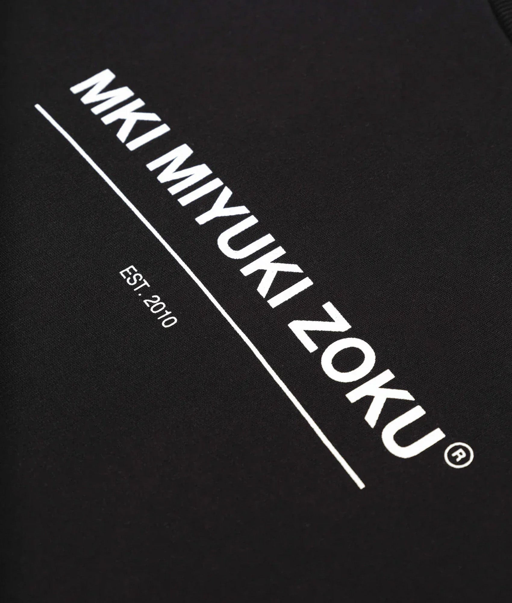 MKI MIYUKI ZOKU Oversized Linear Crewneck Sweatshirt in Black at EQVVS Menswear. Detail shot.
