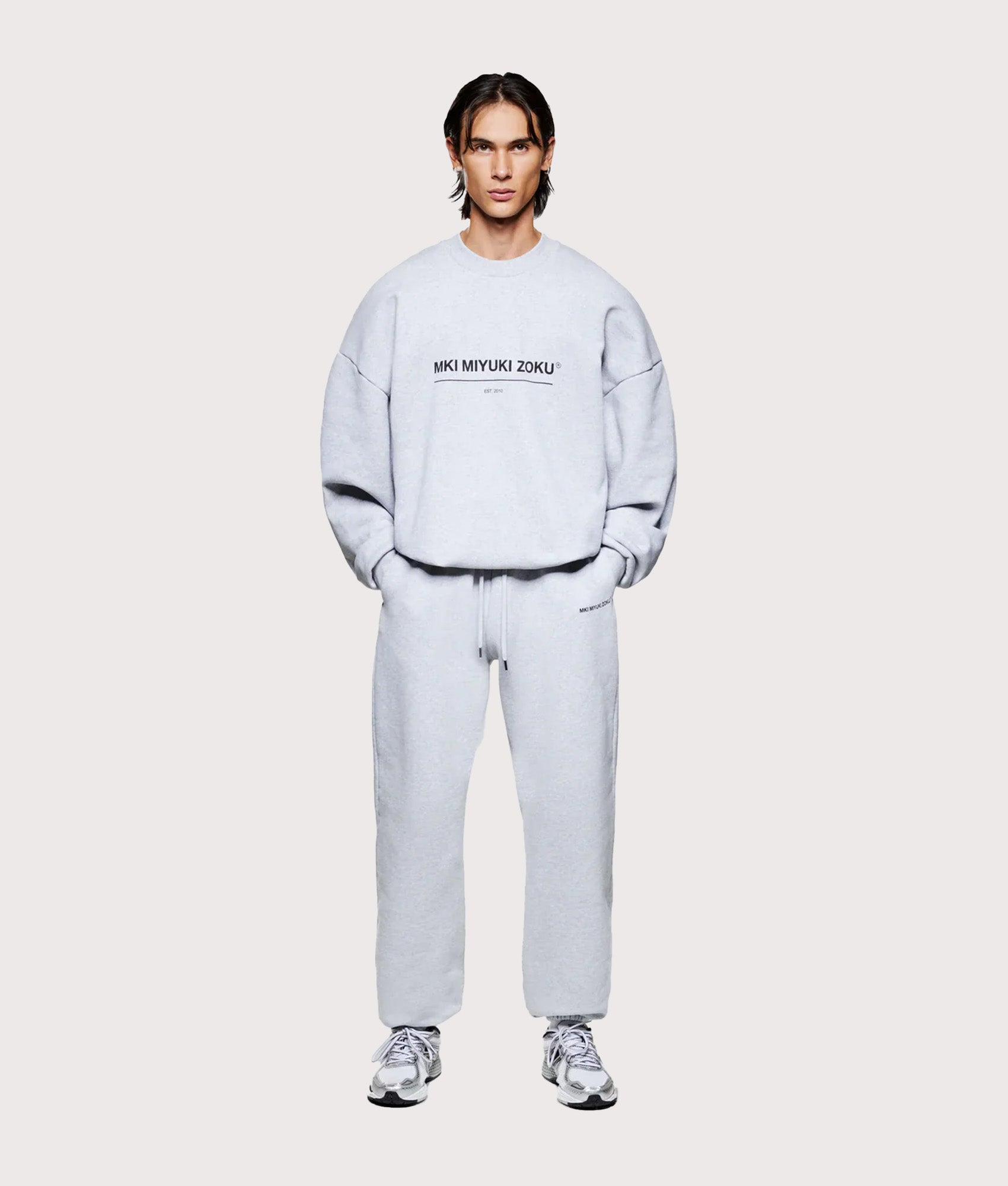 MKI MIYUKI ZOKU Oversized Linear Crewneck Sweatshirt in Grey at EQVVS Menswear. Model front shot.