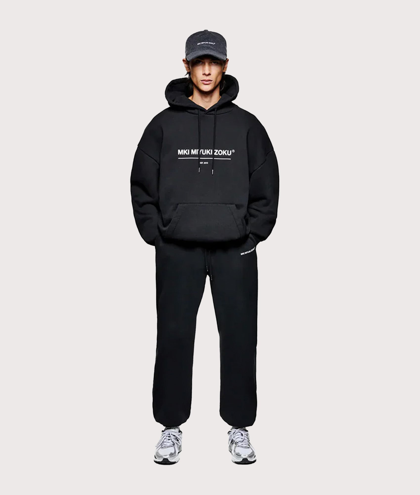 MKI MIYUKI ZOKU Oversized Linear Hoodie in Black at EQVVS Menswear.  Model full front shot.