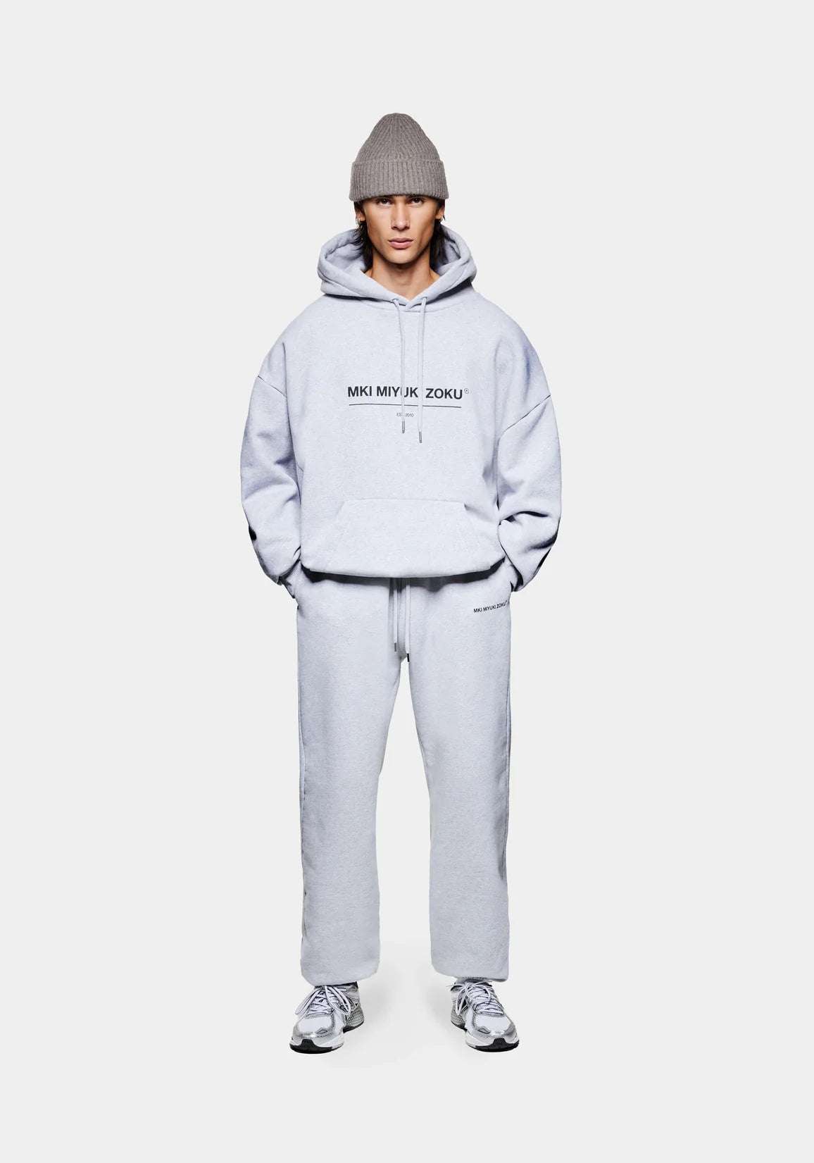 MKI Miyuki Zoku Linear Hoodie in Grey. Shot at EQVVS. Model front shot full. 