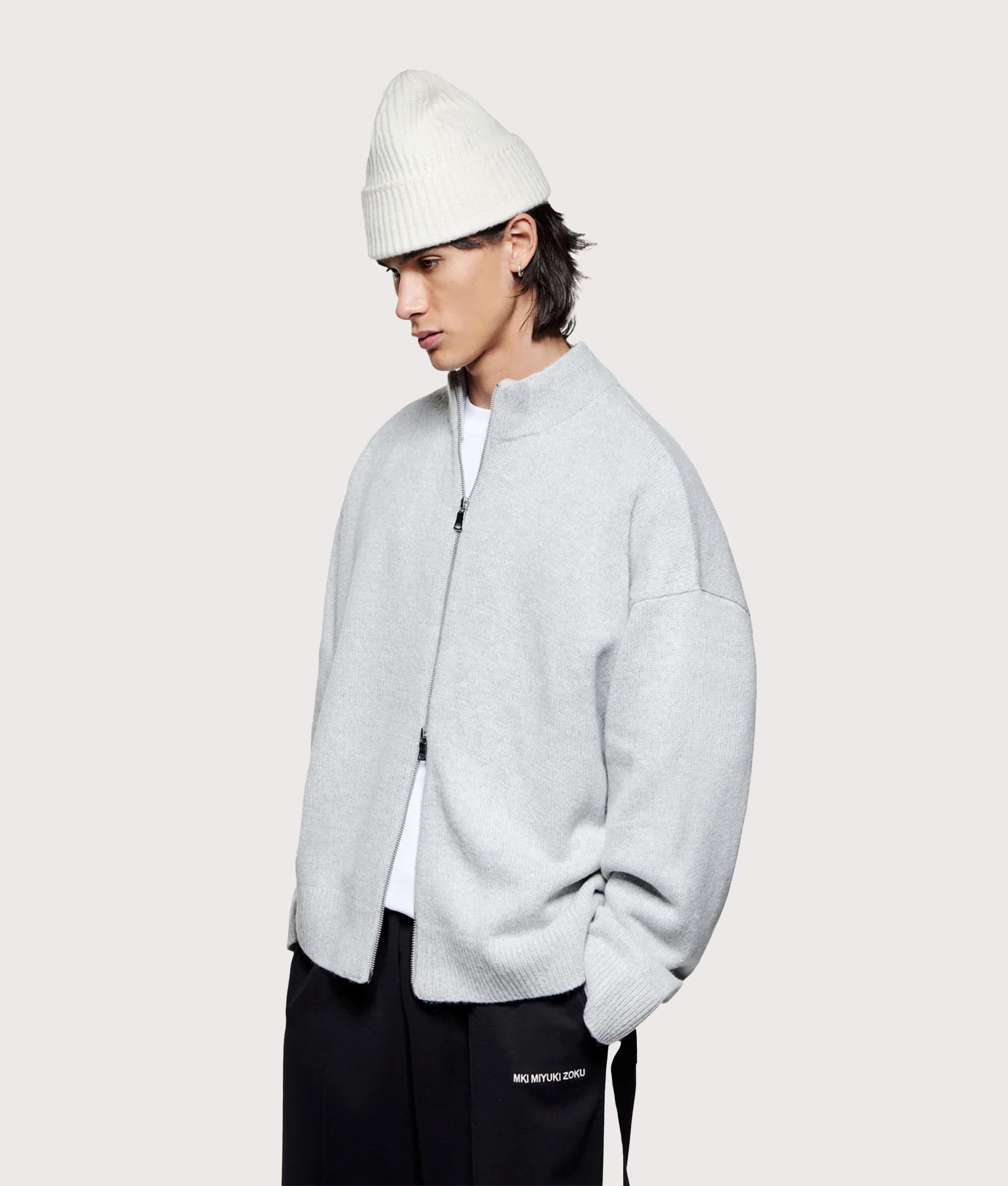 MKI MIYUKI ZOKU Oversized Fit Mohair Blend Knit Track Jacket in Light Grey at EQVVS Menswear. Angled model front shot.