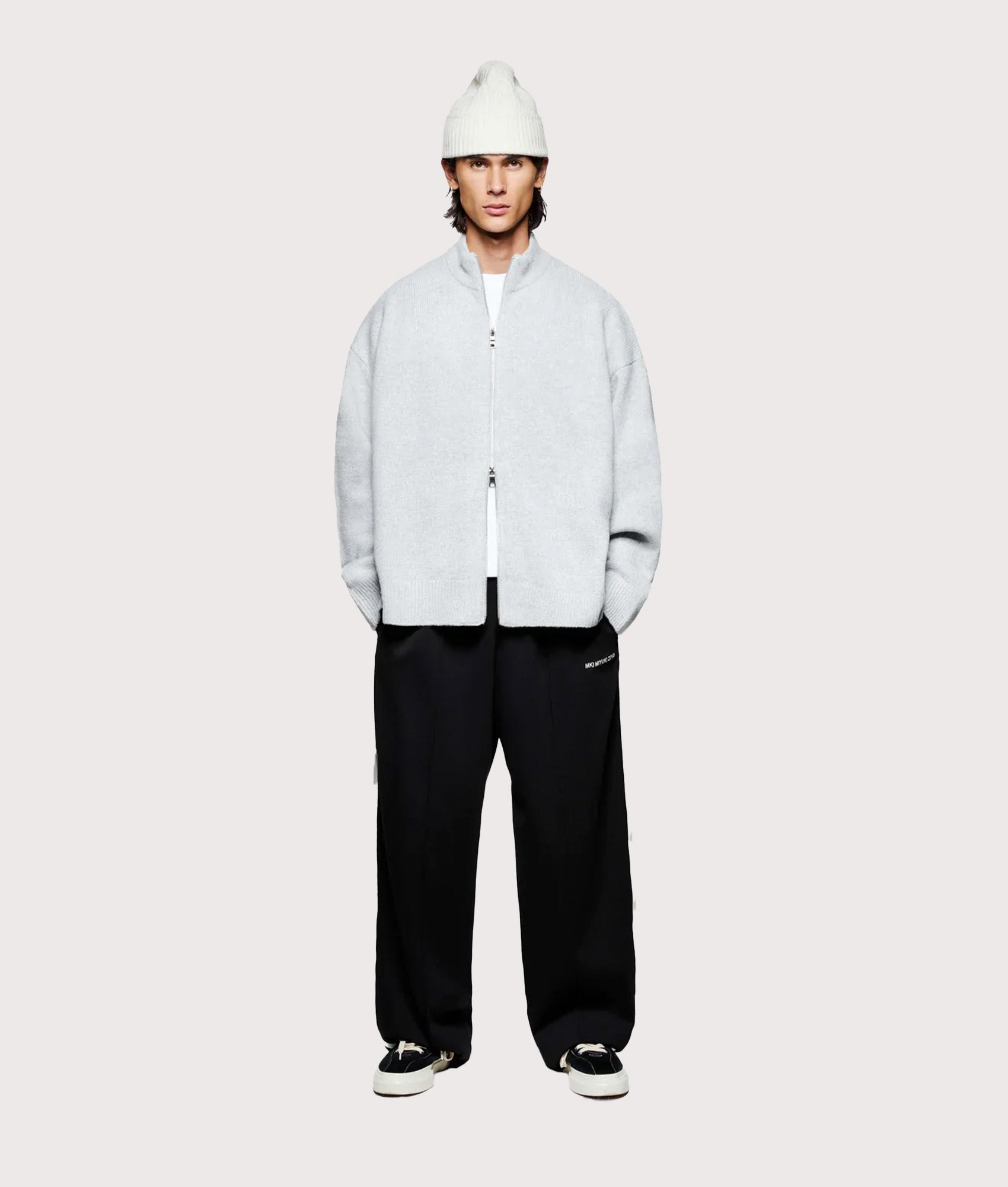 MKI MIYUKI ZOKU Oversized Fit Mohair Blend Knit Track Jacket in Light Grey at EQVVS Menswear. Model full front shot.