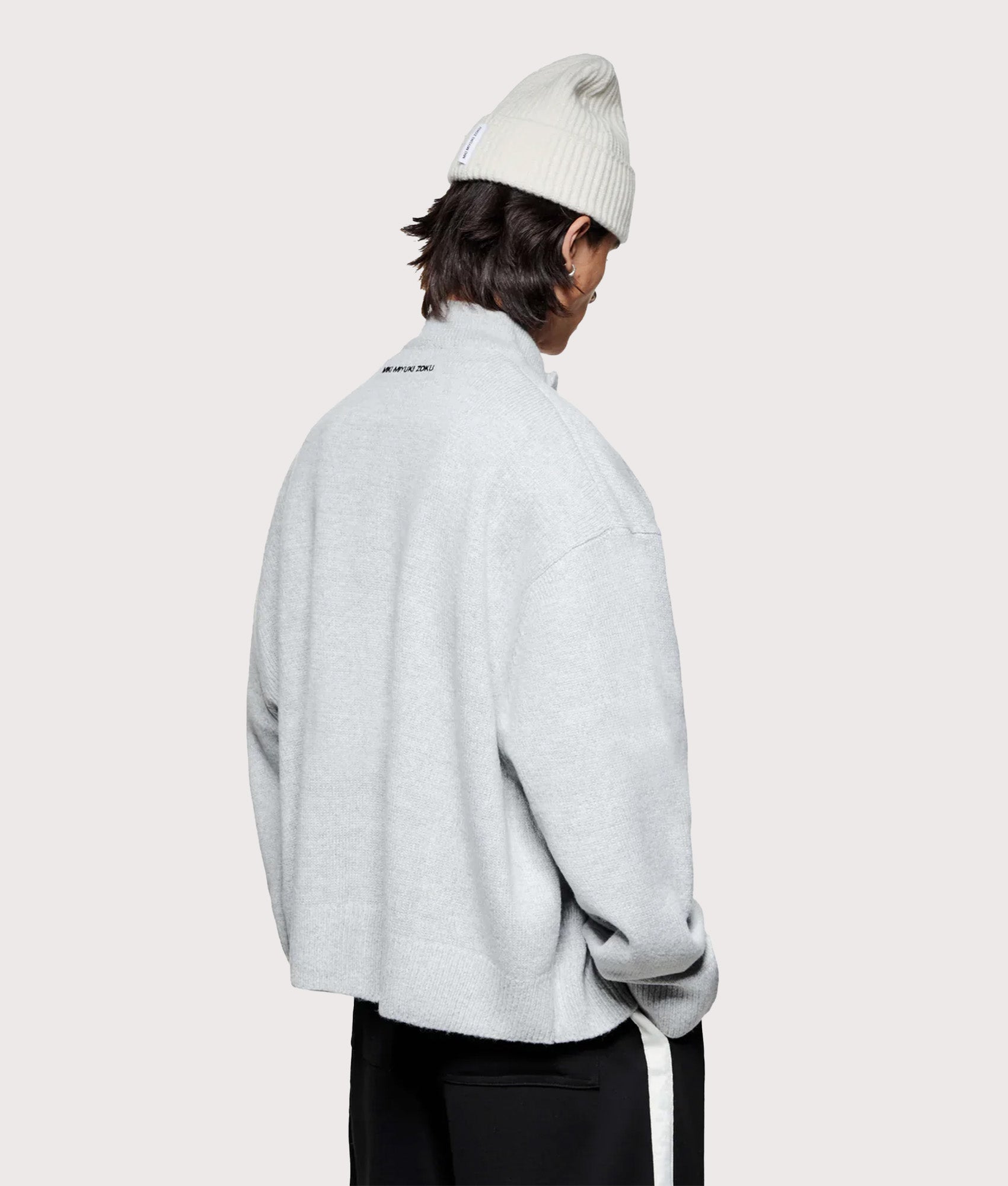 MKI MIYUKI ZOKU Oversized Fit Mohair Blend Knit Track Jacket in Light Grey at EQVVS Menswear. Angled model back shot.