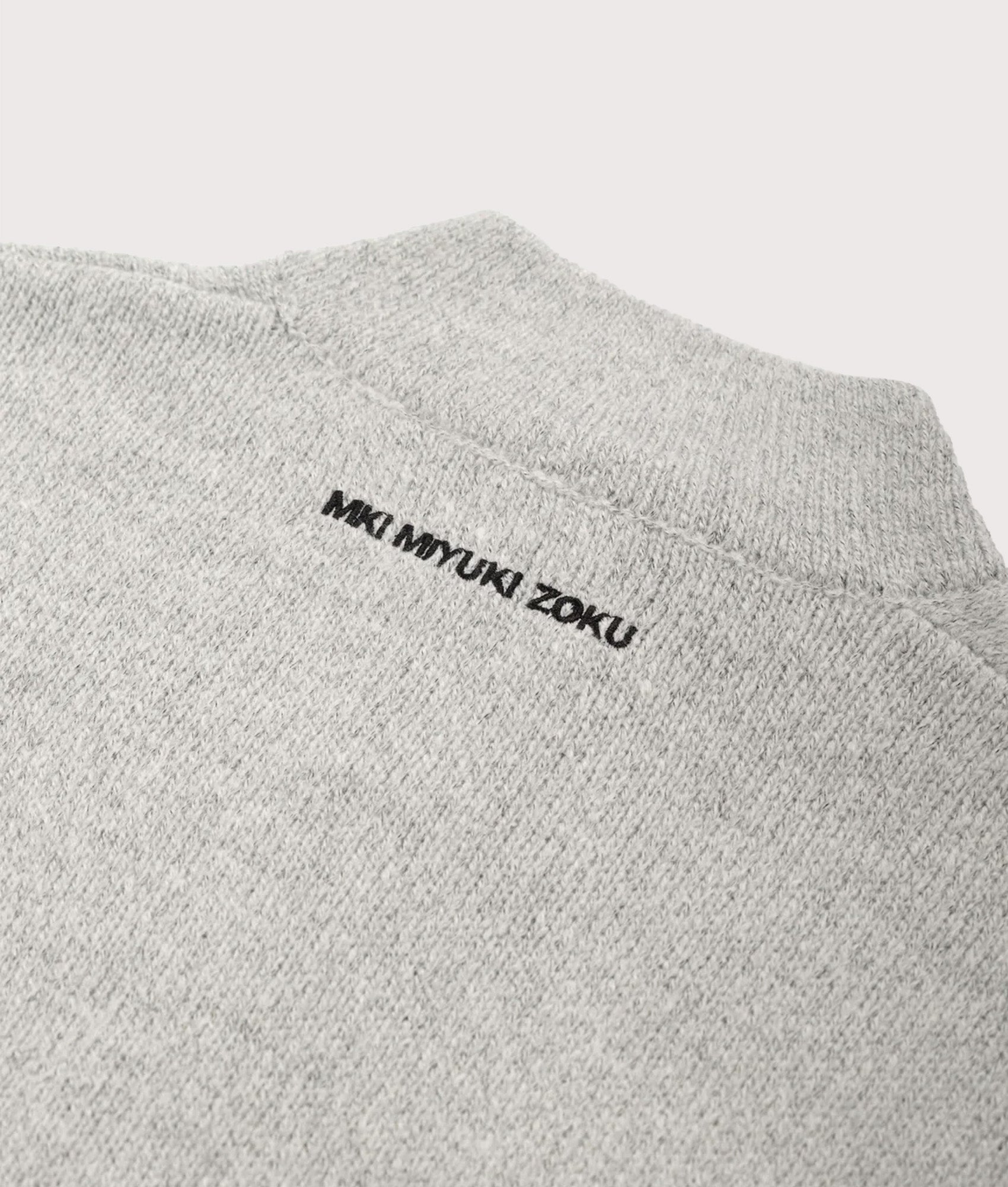 MKI MIYUKI ZOKU Oversized Fit Mohair Blend Knit Track Jacket in Light Grey at EQVVS Menswear. Detail shot.