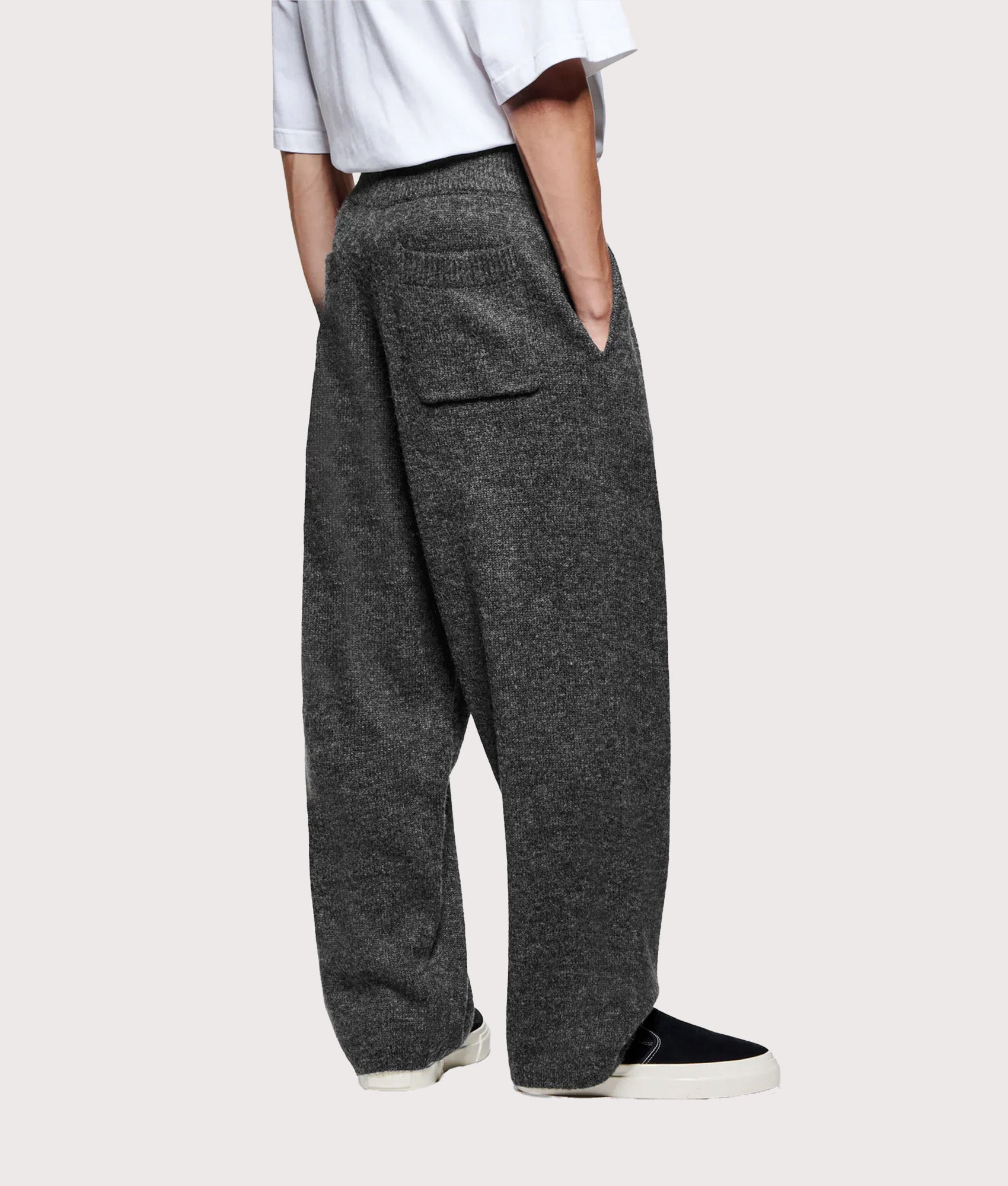 MKI MIYUKI ZOKU Relaxed Fit Mohair Blend Knit Wide Leg Joggers in Charcoal at EQVVS Menswear. Angled model back shot.