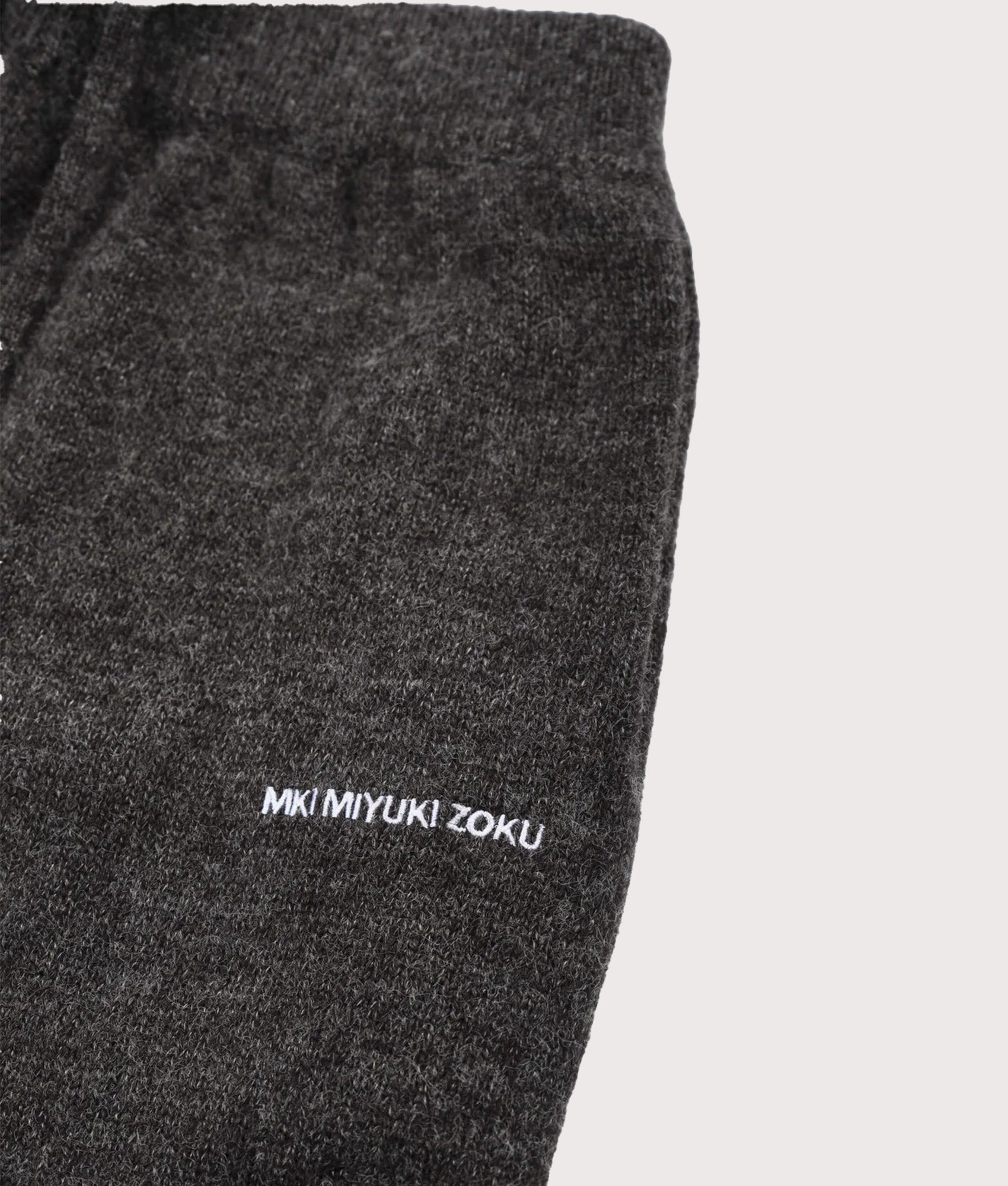 MKI MIYUKI ZOKU Relaxed Fit Mohair Blend Knit Wide Leg Joggers in Charcoal at EQVVS Menswear. Detail shot.