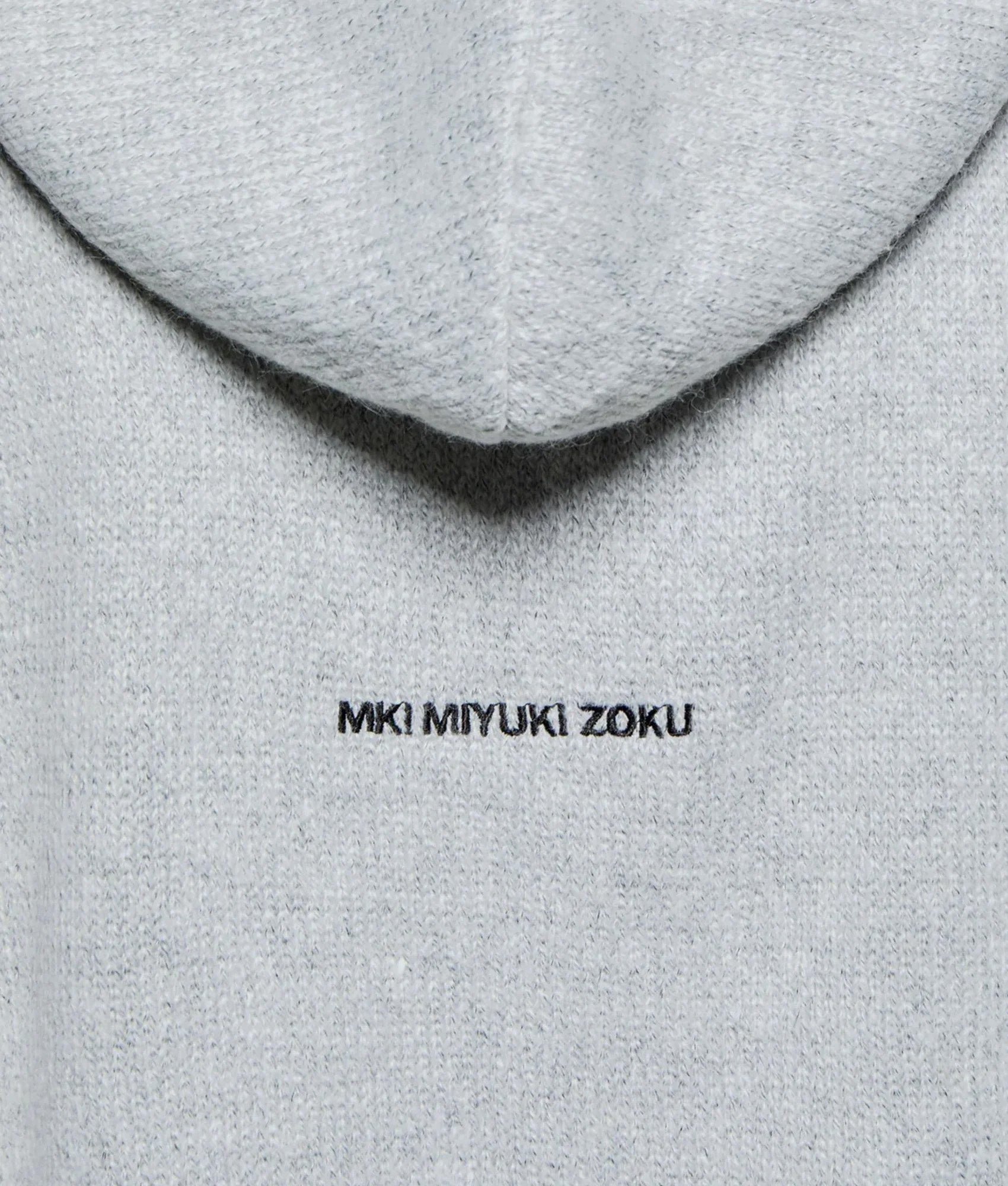 MKI MIYUKI ZOKU Mohair Blend Knit Zip Through Hoodie in Light Grey at EQVVS Menswear. Detail shot.