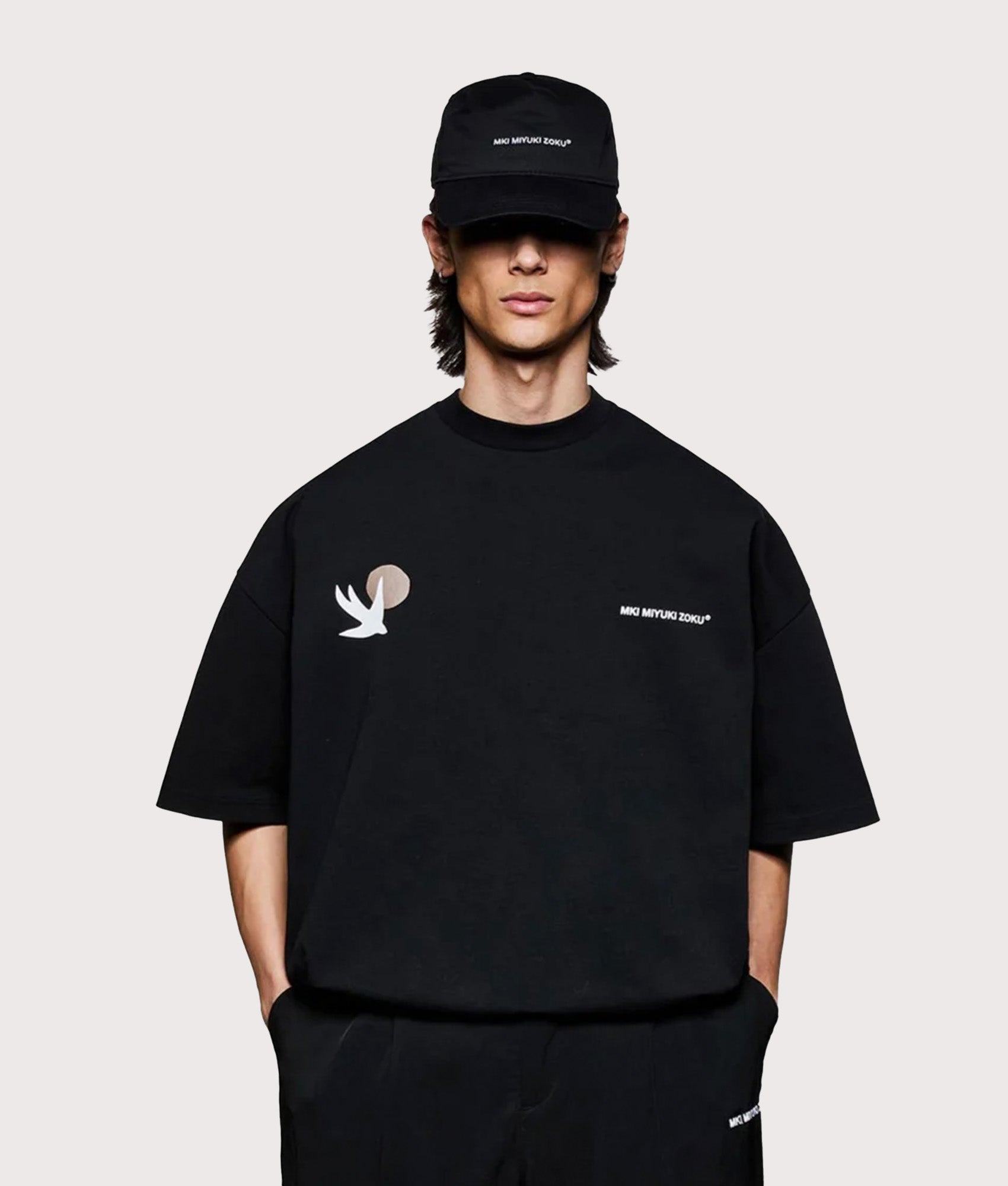 MKI MIYUKI ZOKU Oversized Swallow T-Shirt in Black at EQVVS Menswear. Model front shot.