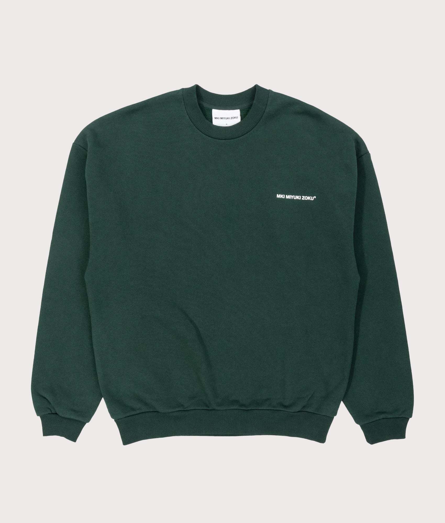 MKI MIYUKI ZOKU Oversized Uniform Crewneck Sweatshirt in Green at EQVVS Menswear. Front shot.